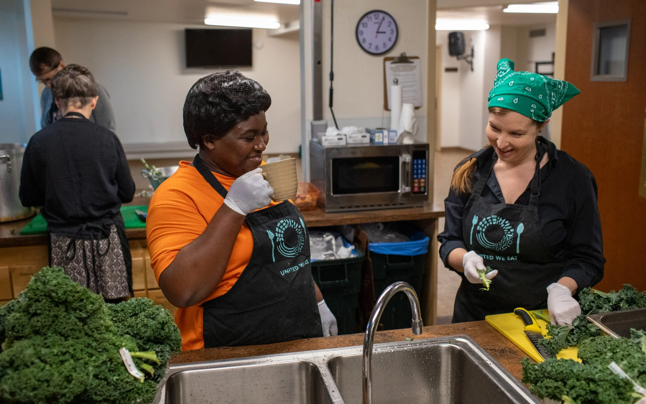 Chef Grace Mussiwa and a UWE volunteer share a giggle during day two of dinner prep at the First Methodist Church in Missoula on Monday, March 11, 2024. Grace is a refugee from the Democratic Republic of the Congo. She's working on becoming an accou