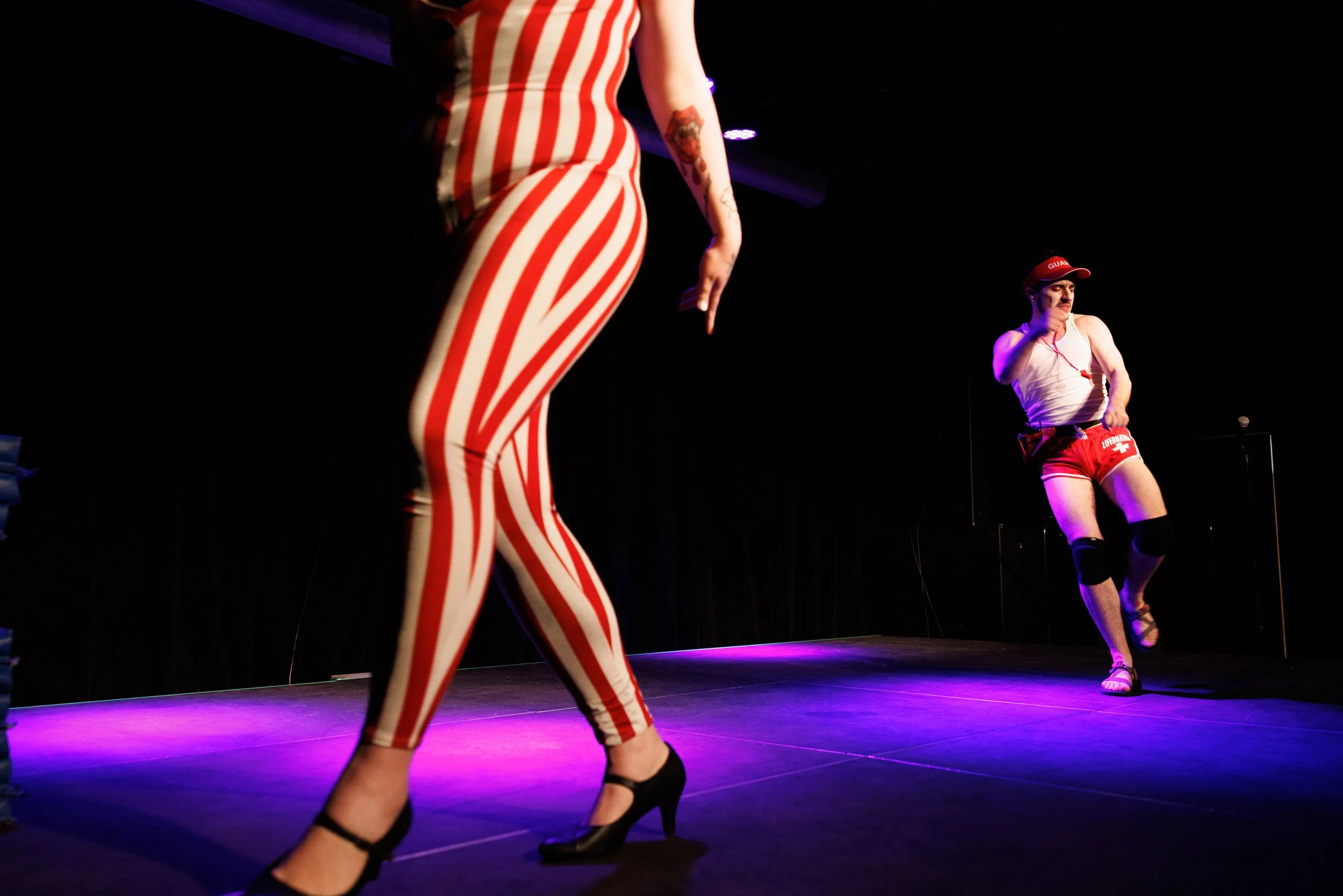 Drag artists Iris Von Moxxi and Ace of Hearts compete in a lip-syncing competition during the Montana Drag Wrestling show at the Zootown Arts Community Center in Missoula, Montana on Saturday, June 7, 2025.