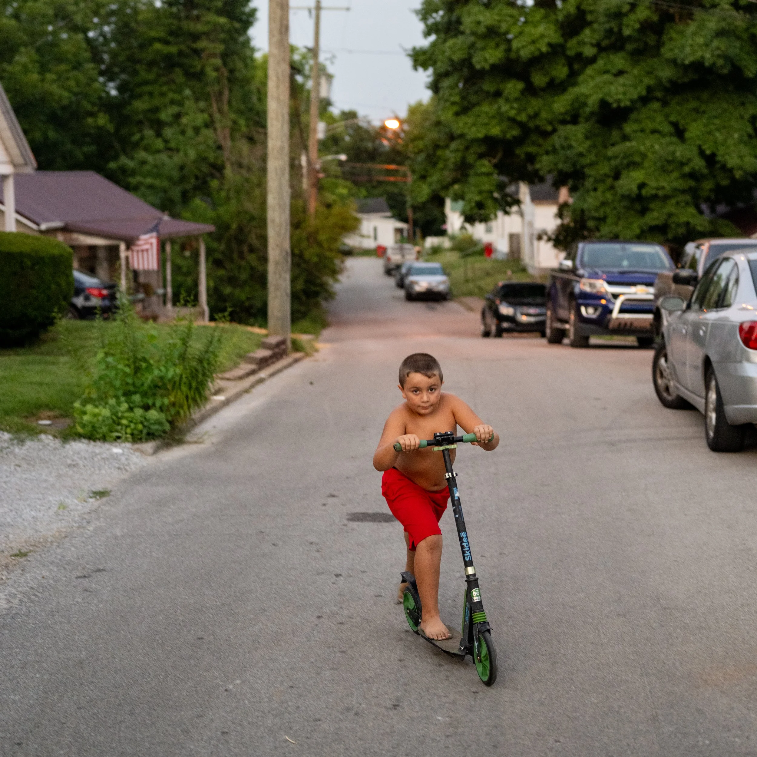 Hunter Gonzaulez, 7, rides his scooter on Broadway Avenue the night before the first day of school on Wednesday, August 7, 2024. 