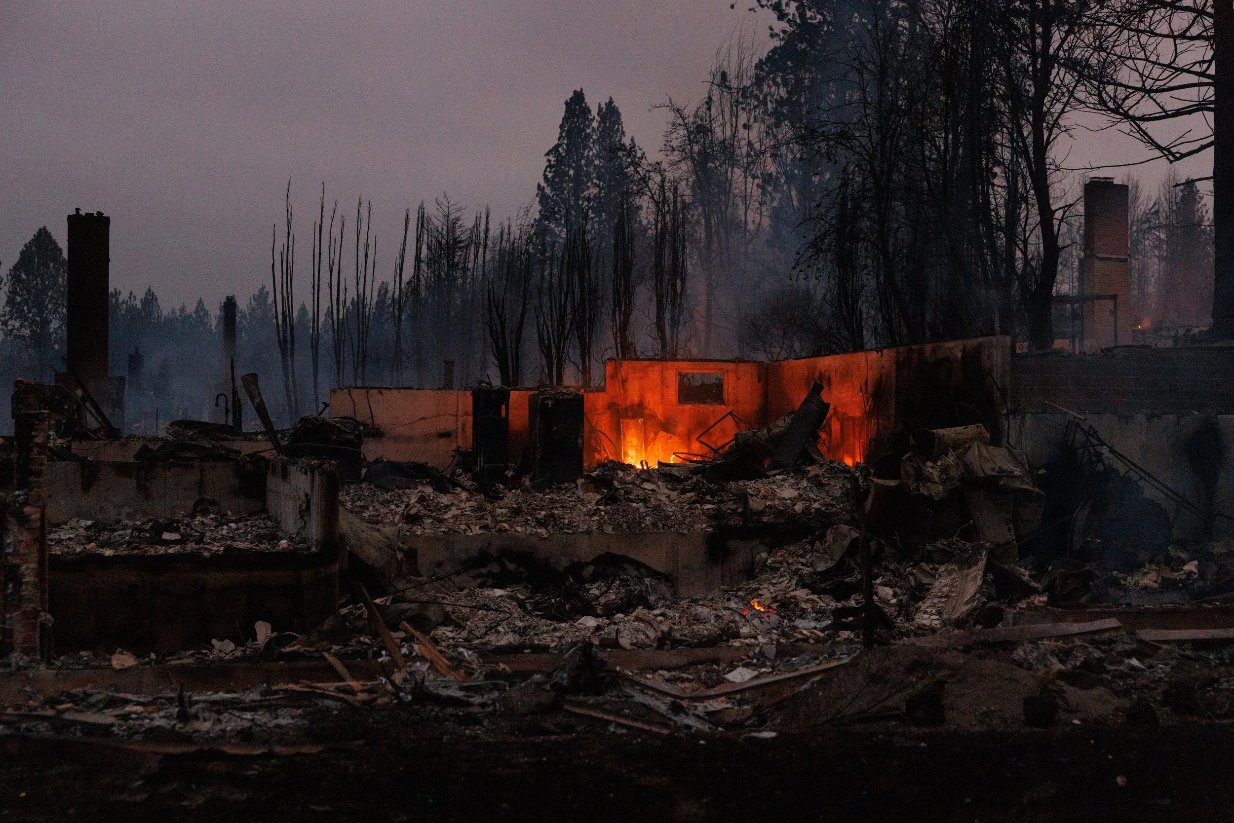 The Old Trail wildfire leveled hundreds of homes overnight in Spokane, Wash. on August 2, 2026. "That is a war zone," said Maj. Gen. Gent Welsh of the Washington National Guard. 