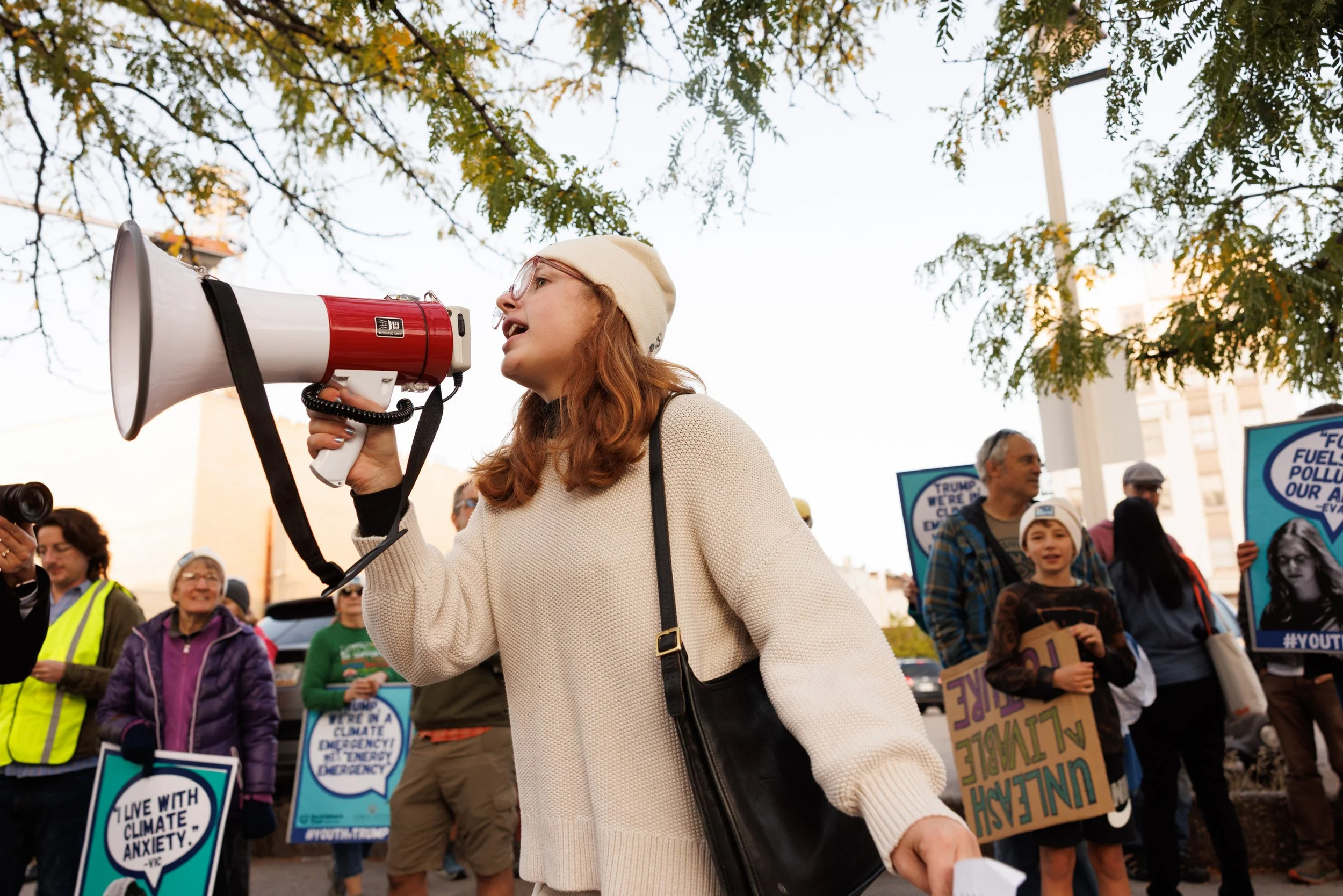 Maddie Greb, a youth climate activist from the University of Montana, leads a chant in support of the youth plaintiffs outside the Russell Smith Courthouse in Missoula, Montana on Wednesday, September 17, 2025. 