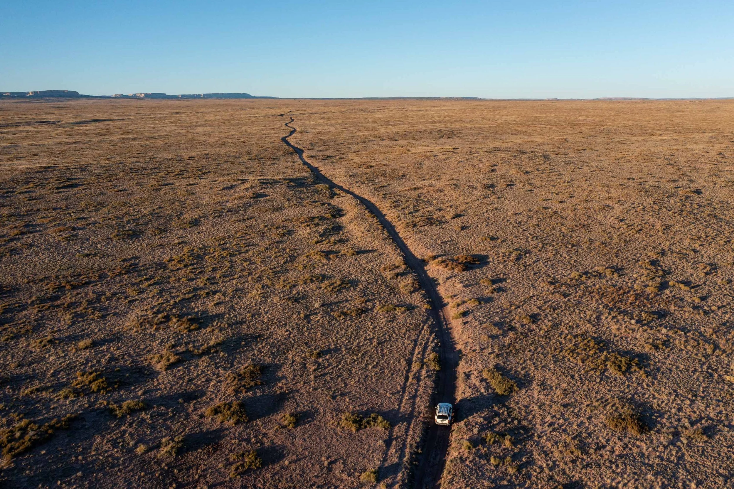 A car driven down a driveway on the Navajo Nation on Saturday, October 19, 2025. To get to school, Navajo students typically must travel rural dirt roads like this one. The Secure Rural Schools program provides critical funding for rural infrastructu