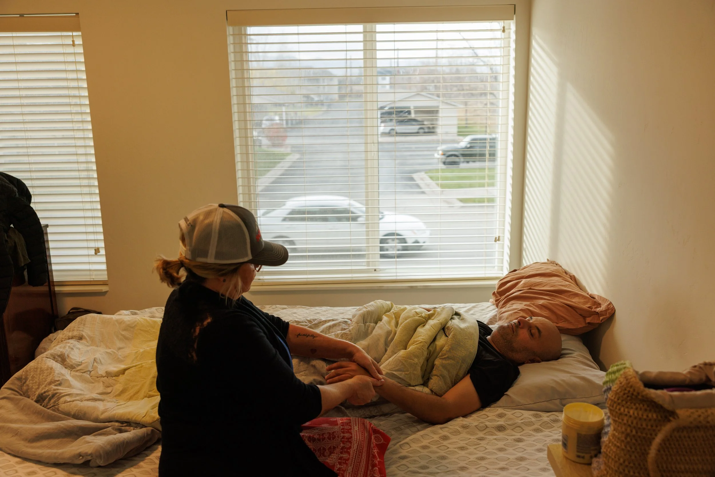 Abeer's husband, who has ongoing health issues, receives a massage to help mitigate chronic neck and spine pain on Thursday, November 13, 2025. The refugee community is perhaps even more worried about the potential loss of Medicaid coverage in 2026.