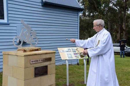 Emeritus Archbishop Adrian Doyle blessing the memorial .