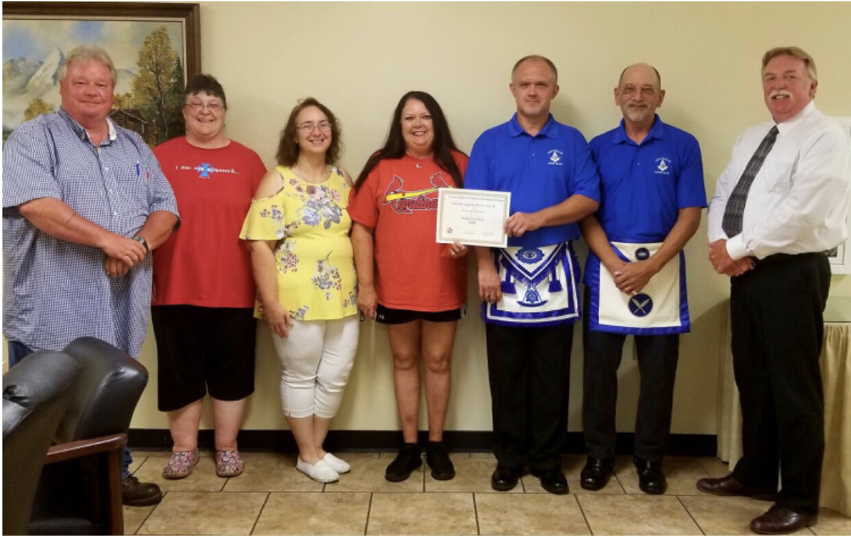 Left to right: Wamac Mayer Brother Butch Mathus, Lora Grose, Tina Ford, Gina Feazel, Master Matt Mullins, Secretary William Evans, and Wamac Chief of Police Steve Prather. The Centralia Masonic Lodge #201 A.F. &amp; A.M presenting the Youth Organiza…