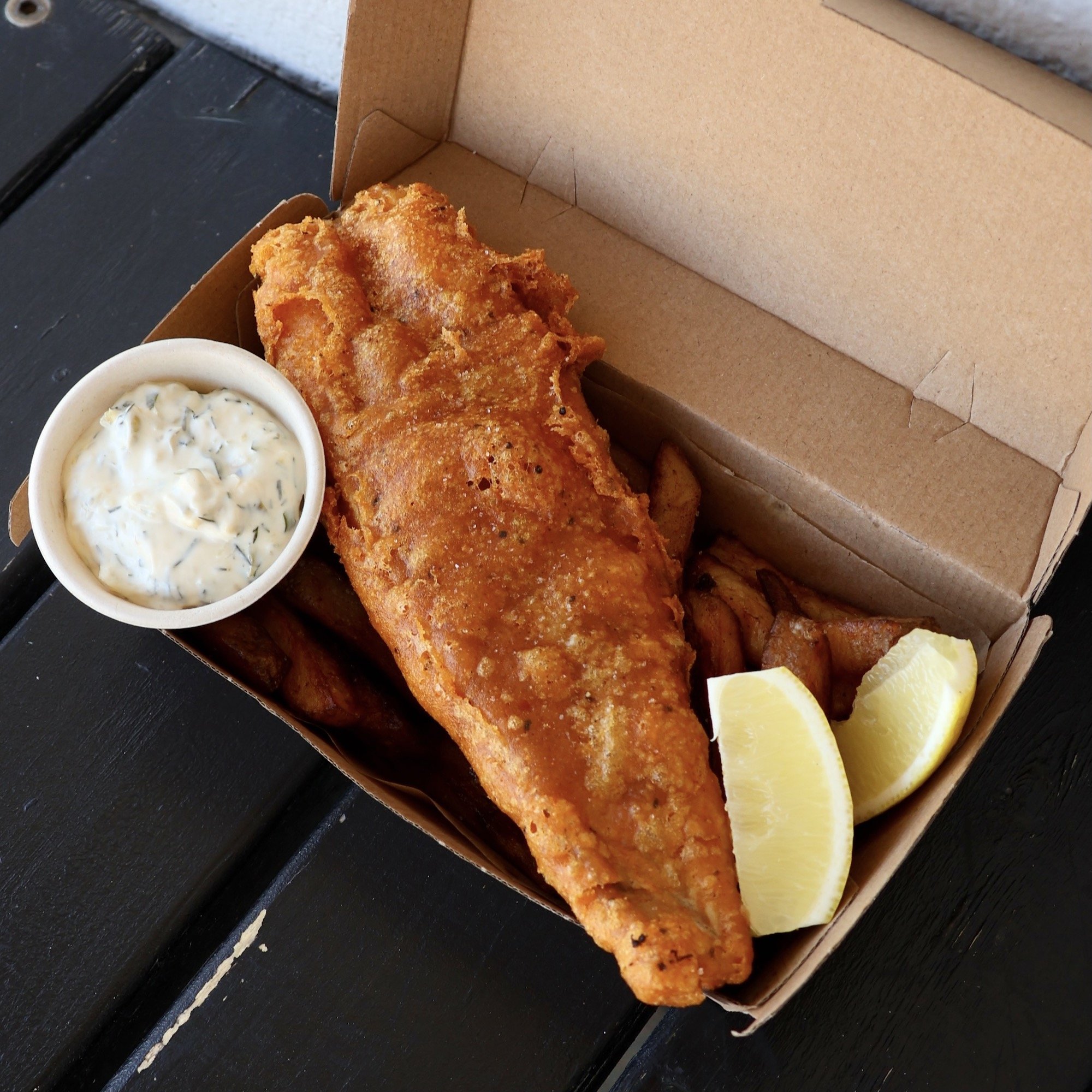 Frankies Fish &amp; Chips - House battered barramundi, southern style spiced salt, thrice cooked housemade chips, yogurt tartare and lemon wedges.