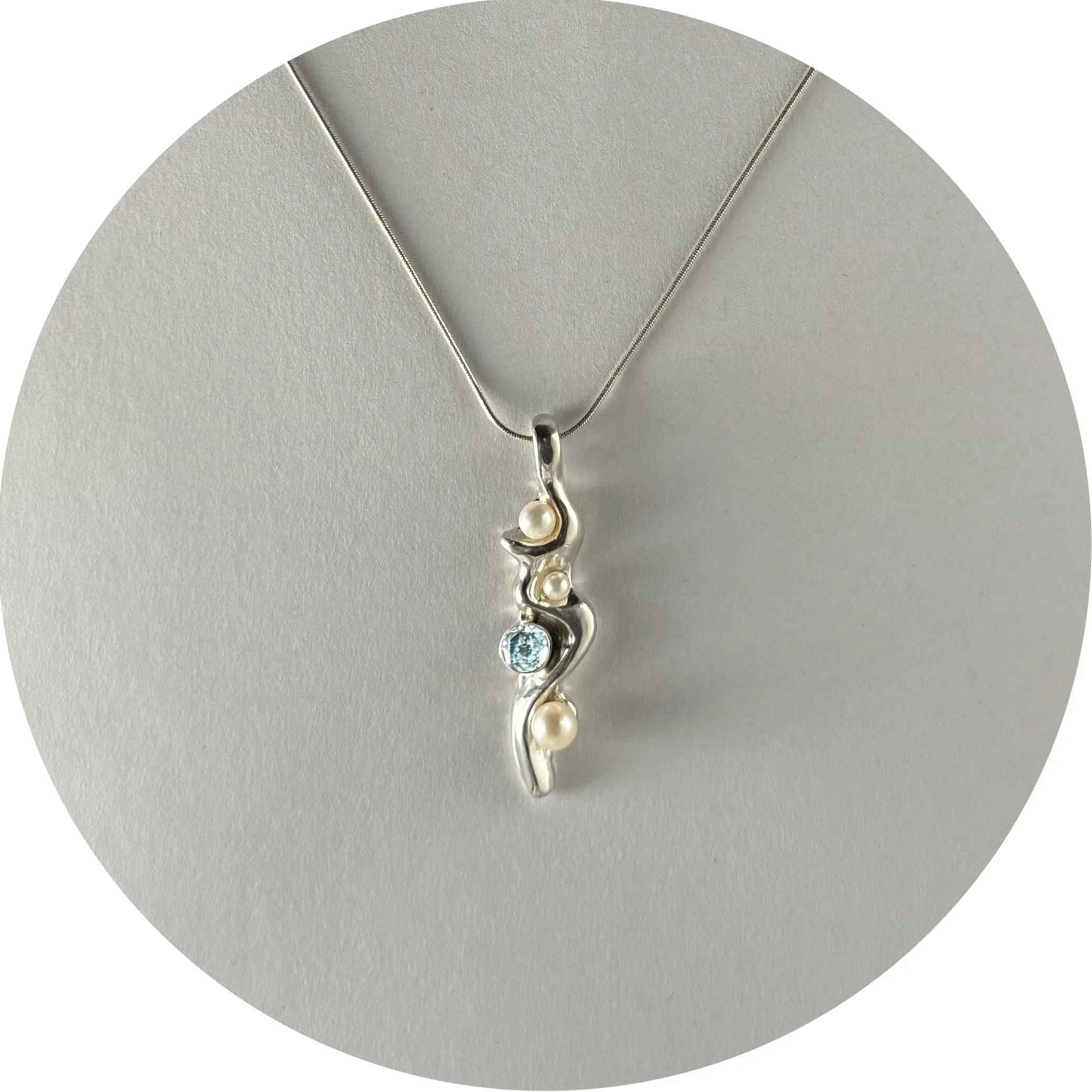 P Zircon and Pearl Winding Pendant.jpeg