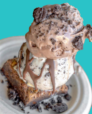 Brownie a La Mode - Freshly-made brownies with two mini scoops if ice cream and your choice of topping and drizzle.