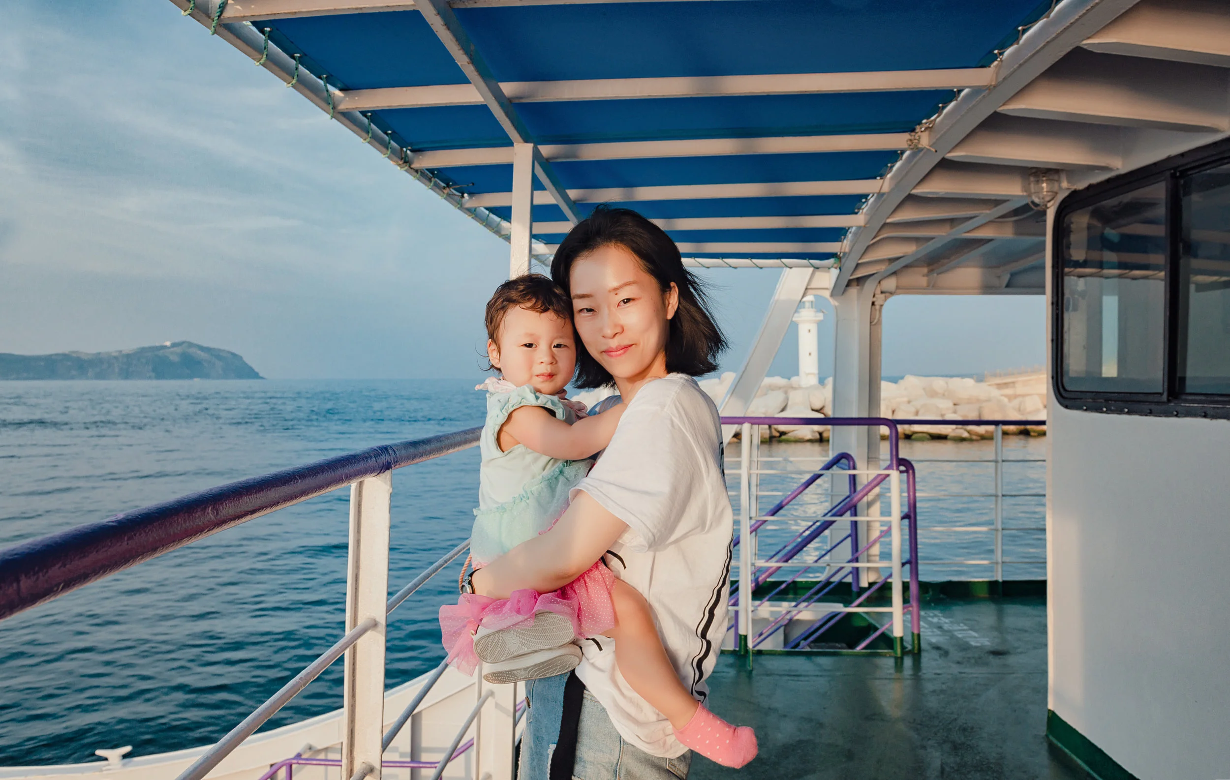My daughter and wife on a ferry boat from Jeju Island to Udo Island