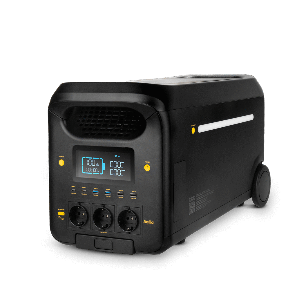 Een zwarte draagbare elektriciteitsgenerator met een digitale display, meerdere stopcontacten, USB-poorten en wieltjes.