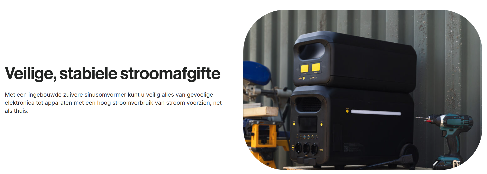 Een afbeelding van een zwarte elektronische generator met gele knoppen en een accu, geplaatst in een werkplaats of garage, naast een blauwe boormachine.