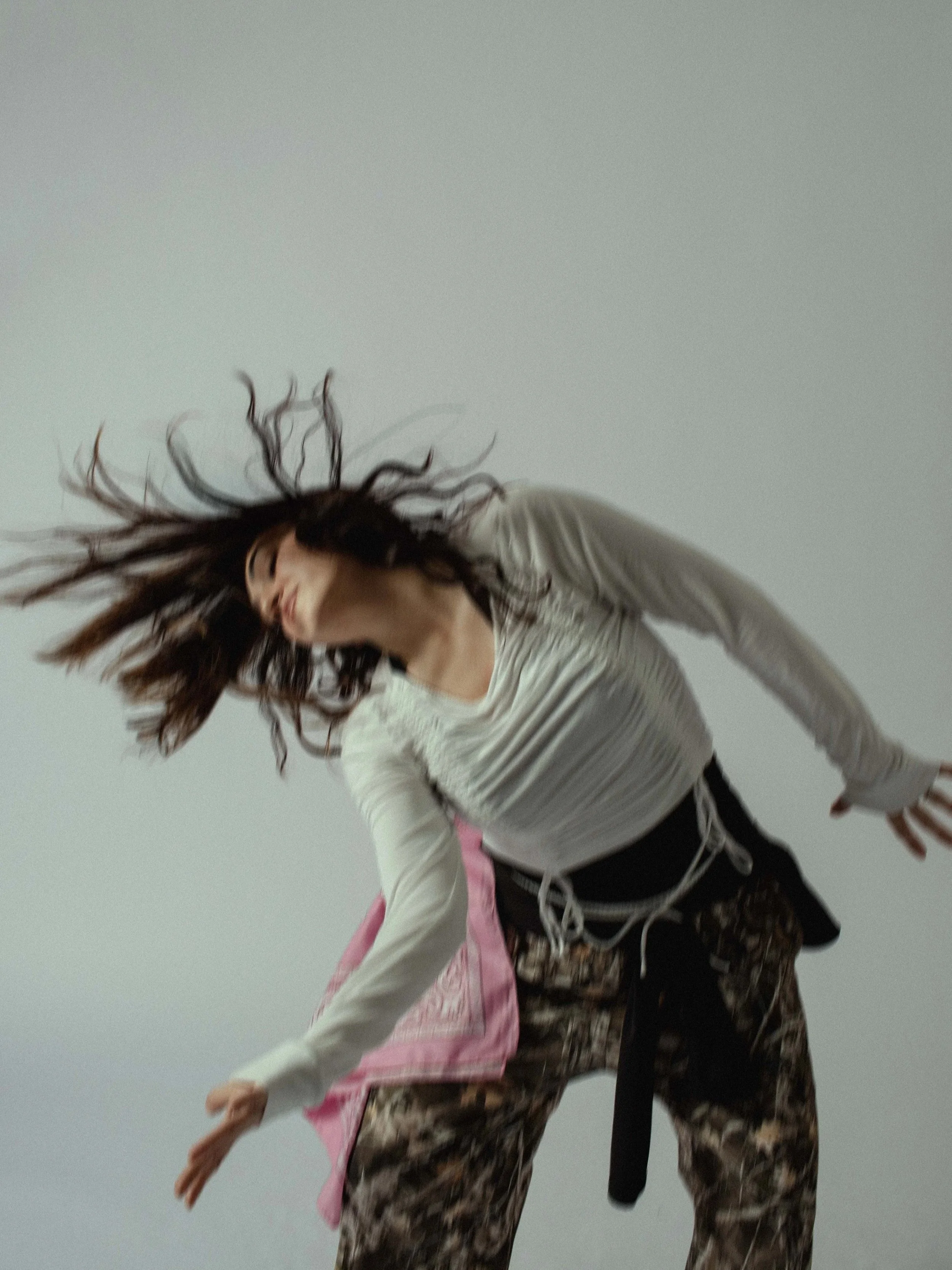 photograph of a dancer mid improv hip hop movement