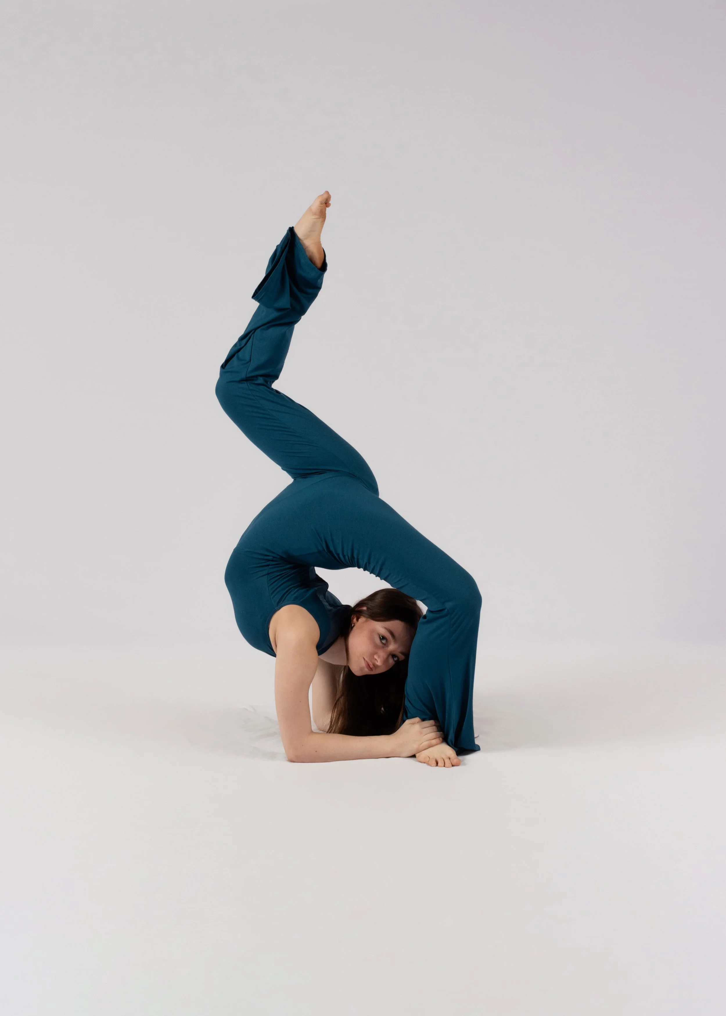Studio image of an acrobatic dancer highlighting athletic ability