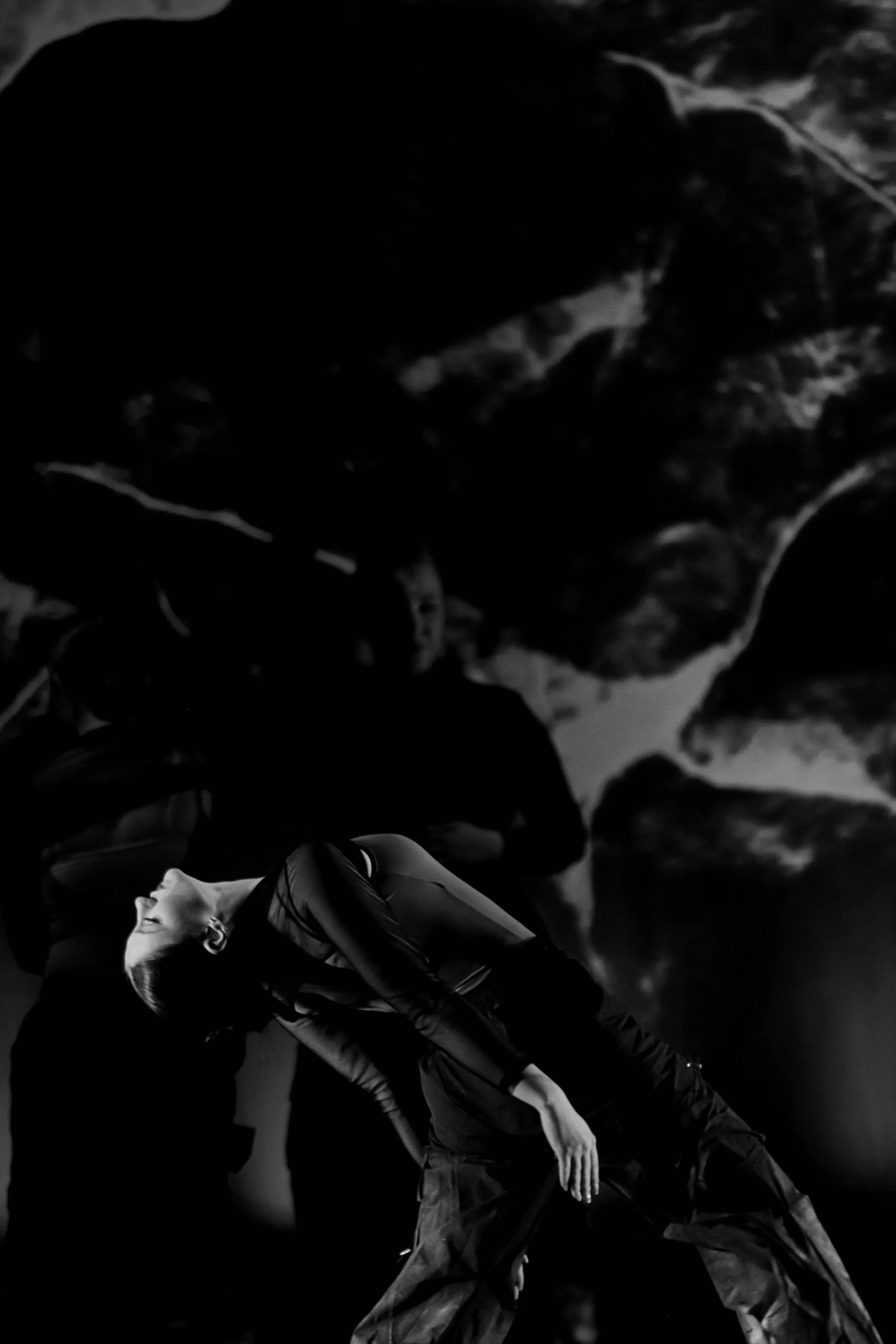 Dancer on stage performing contemporary dance movement
