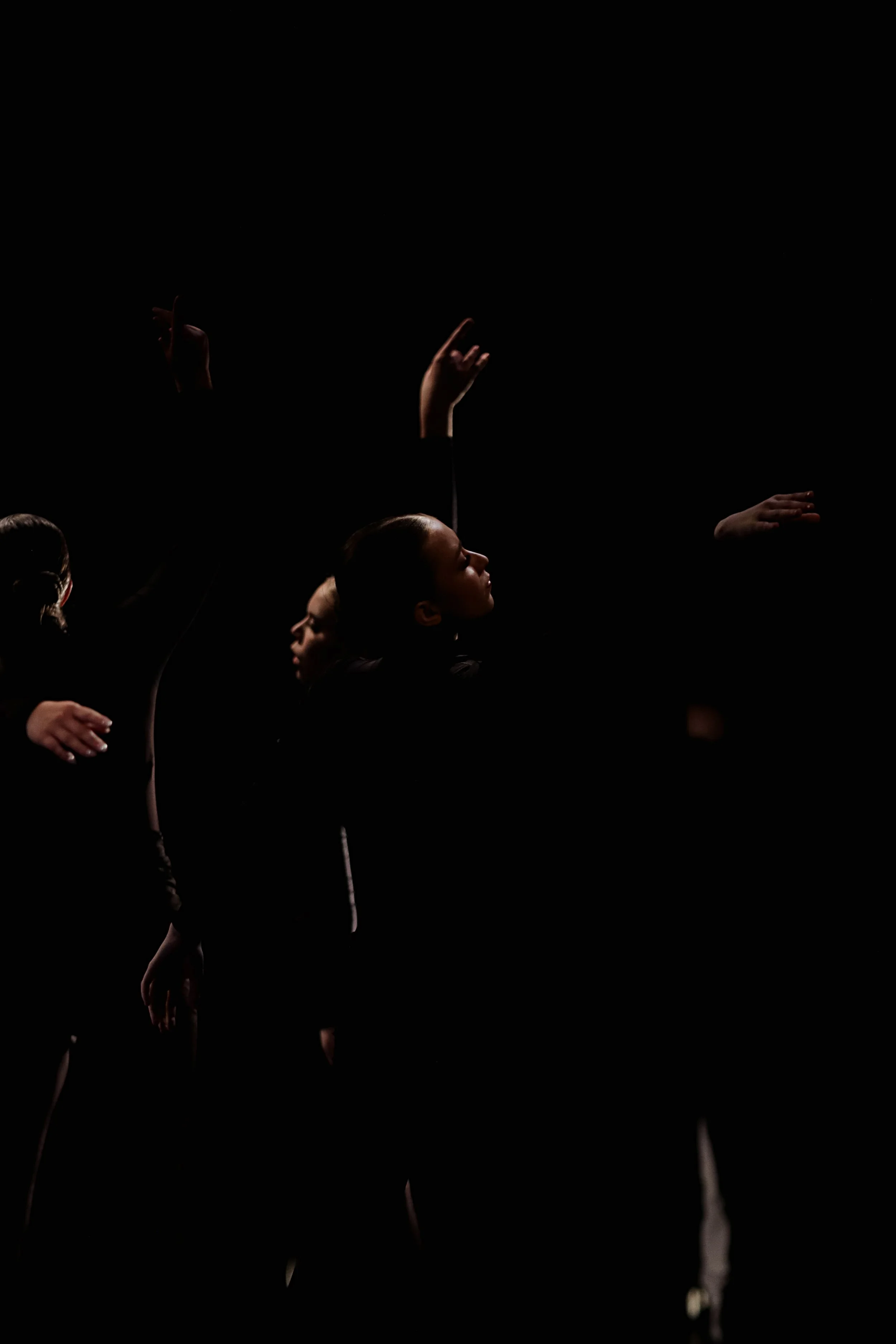 contemporary dance performance with dramatic stage lighting