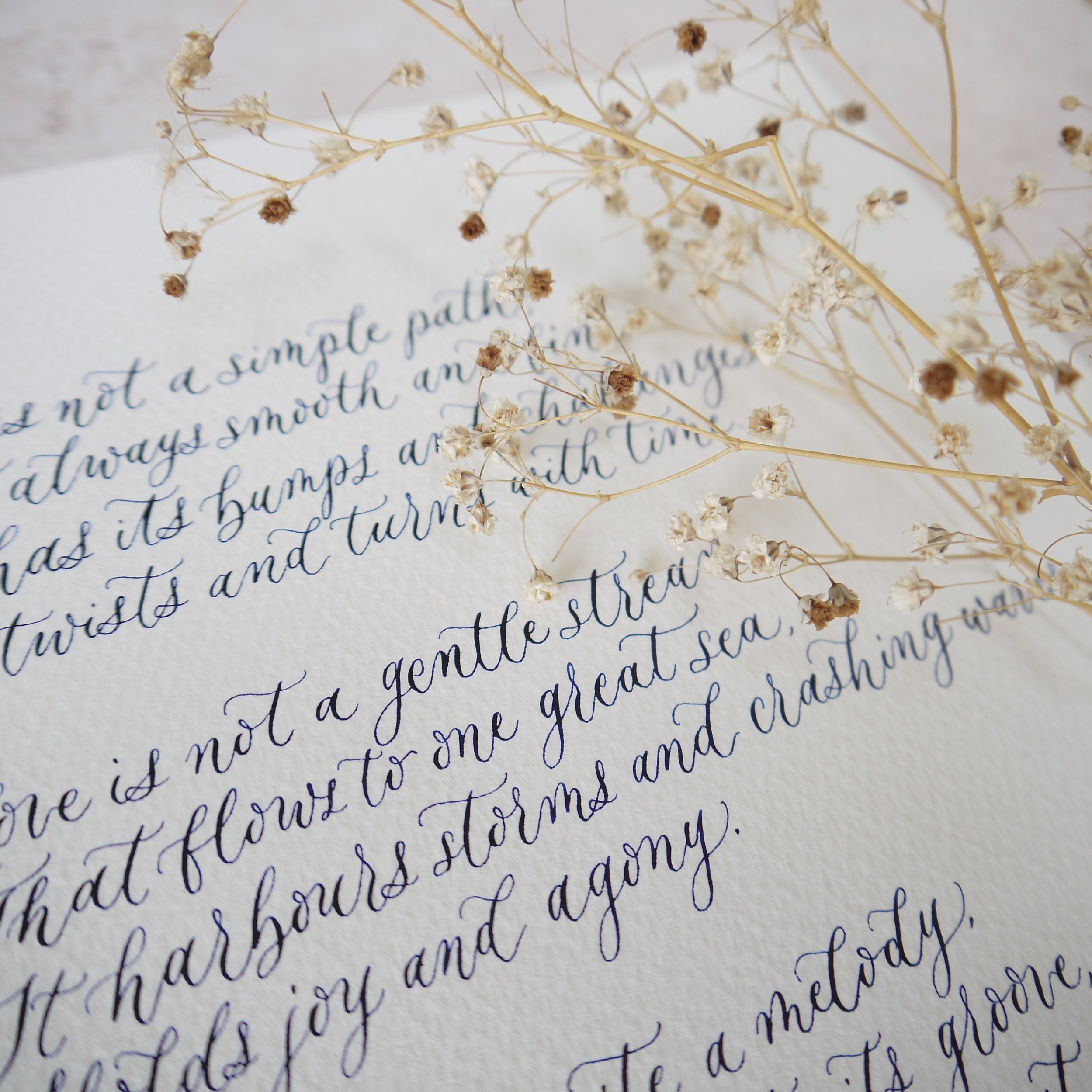 Handwritten calligraphy poem in pen and ink