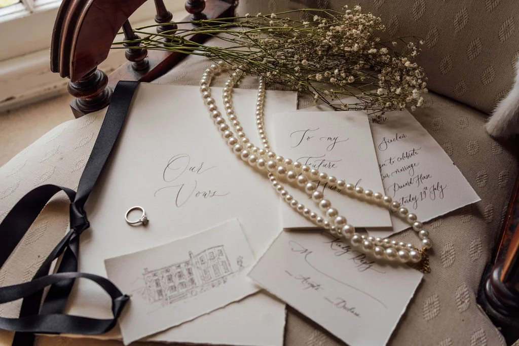 Luxury wedding invitations printed on fine paper in monochrome palette