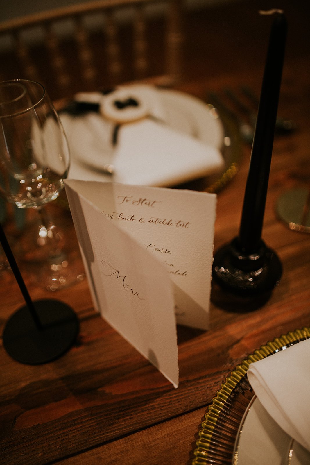 Luxury black and white wedding tablescape with calligraphy details