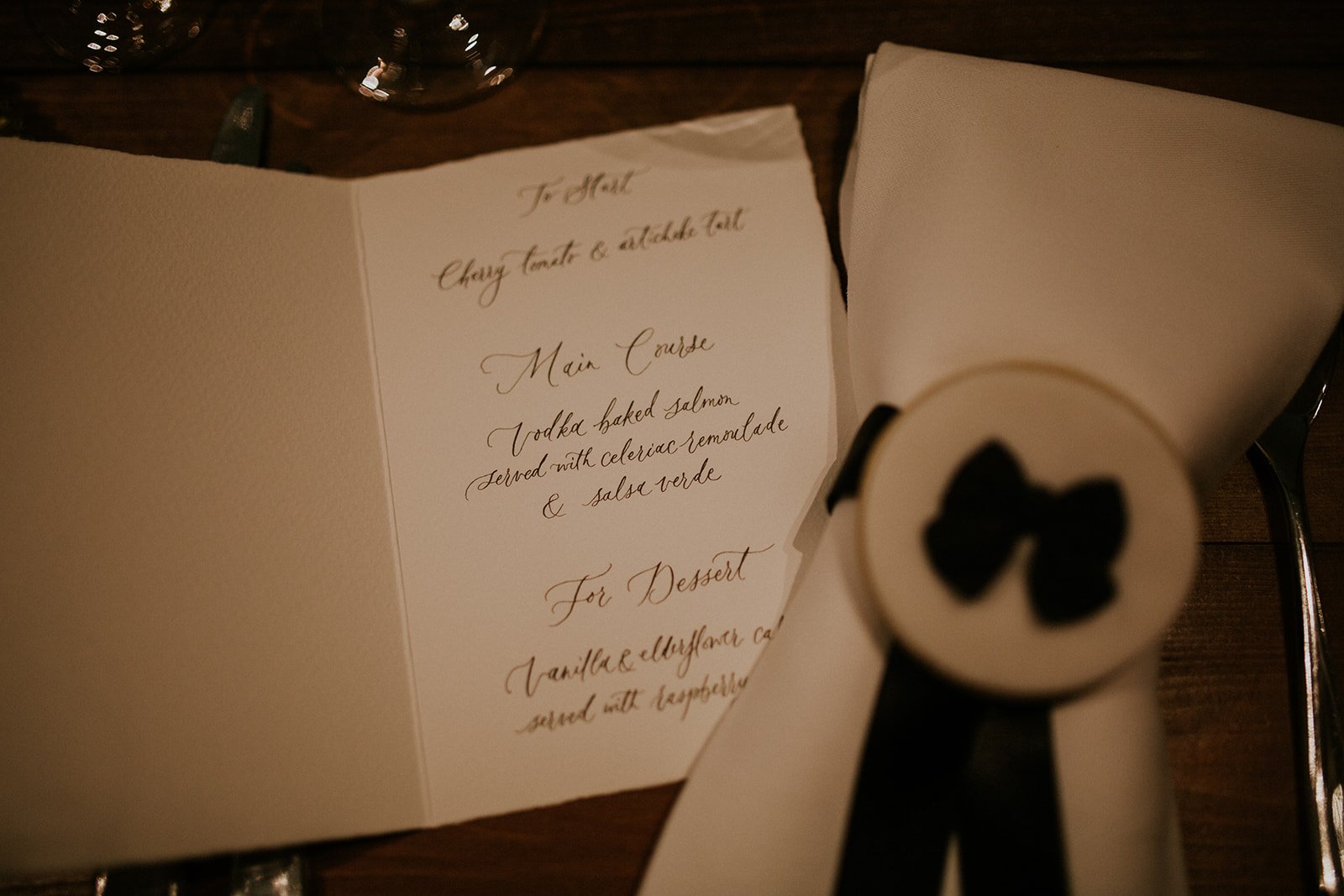 Handwritten wedding menu in flowing calligraphy script