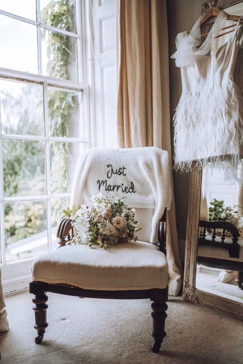 Elegant black and white wedding at Pennard House in Somerset countryside with candlelight and romantic garden florals