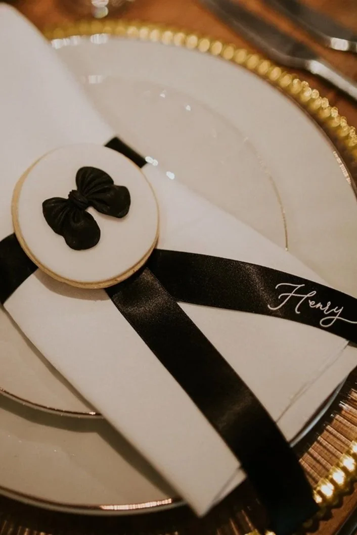 Silk ribbon wedding place names with white calligraphy for luxury seating design