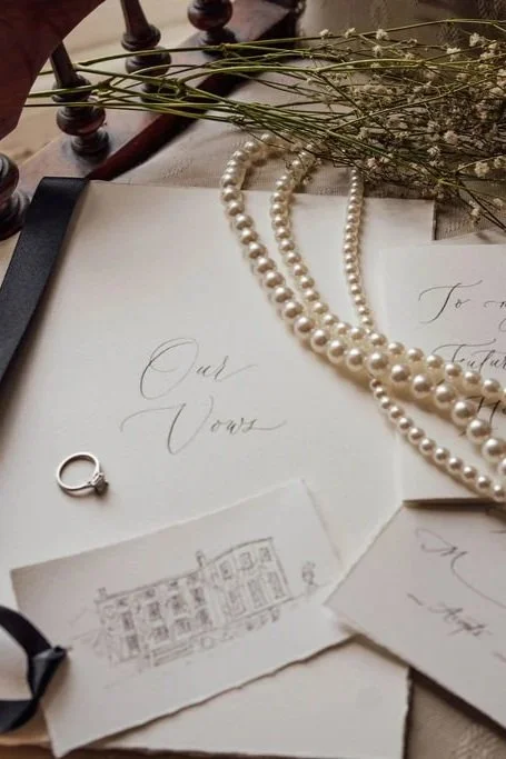 Luxury wedding invitations printed on fine paper in monochrome palette