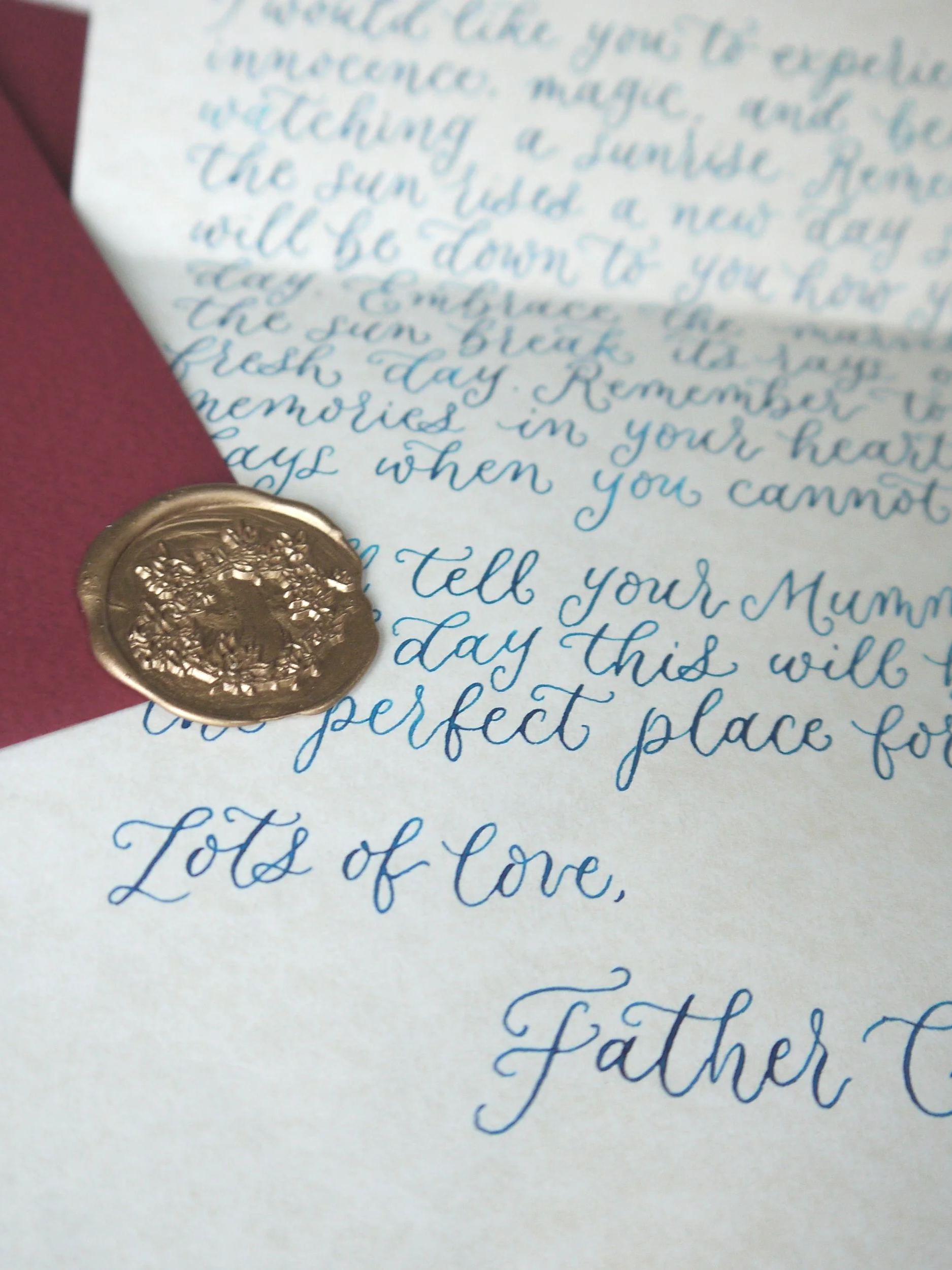 Handwritten letter from Santa Claus to a child with a gold wax seal