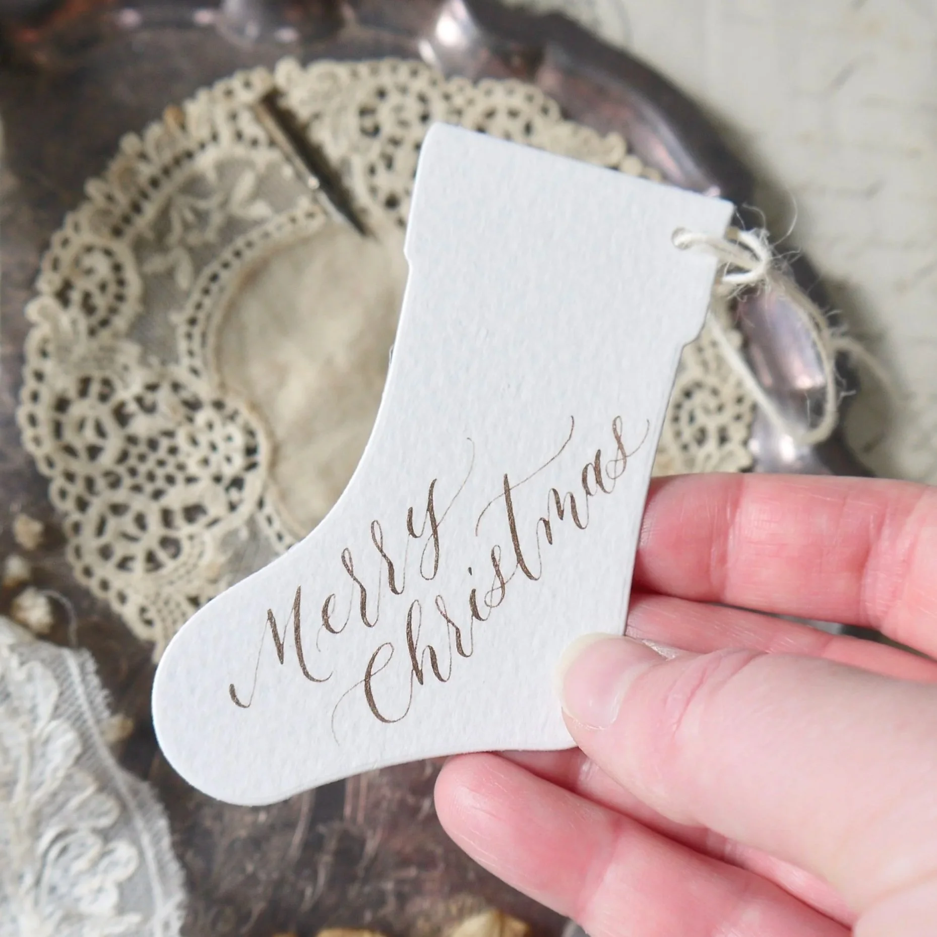 Personalised Christmas gift tag reading 'Merry Christmas' in handwritten calligraphy