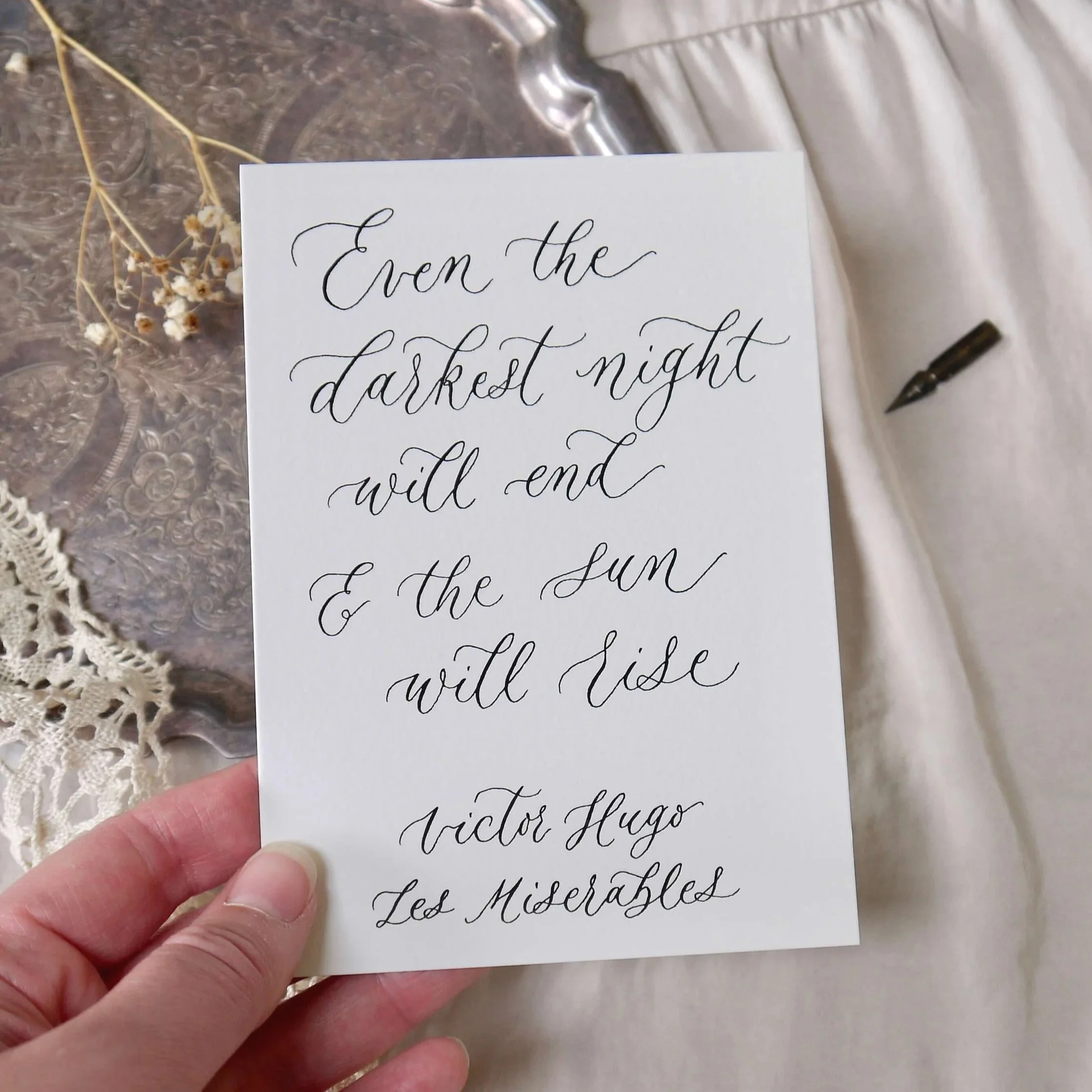 Romantic handwritten calligraphy poem on textured paper