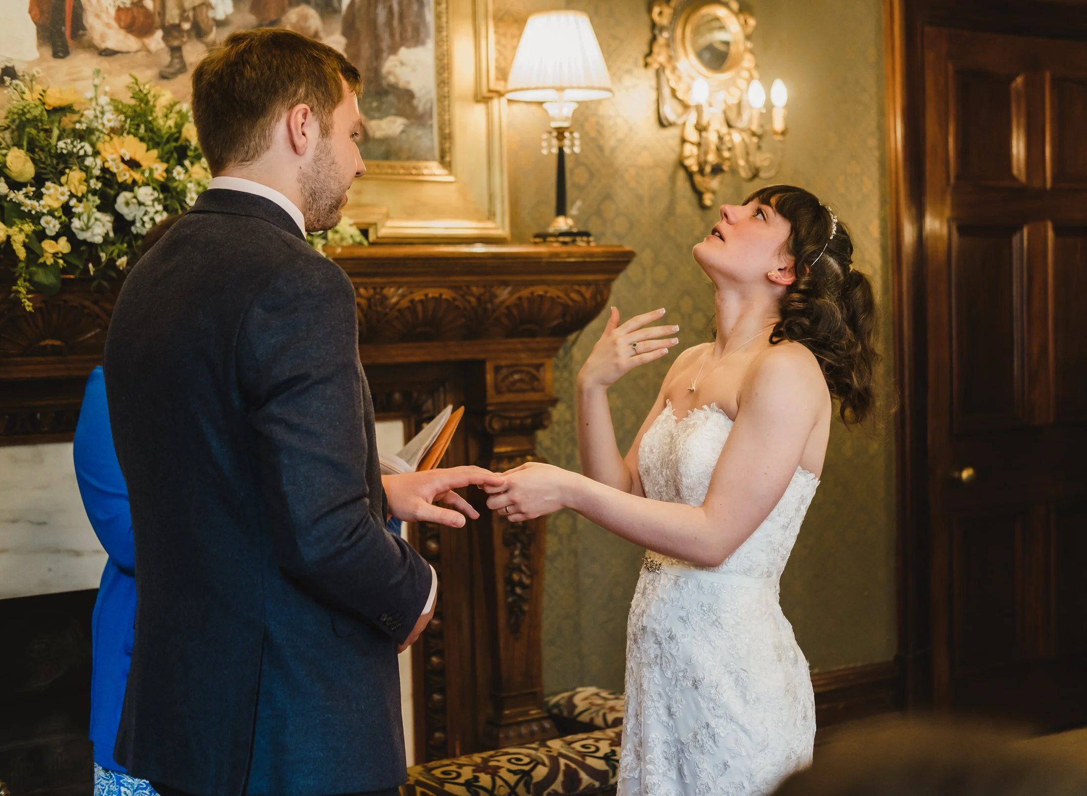 emotional bride exchanging rings at Kilworth house