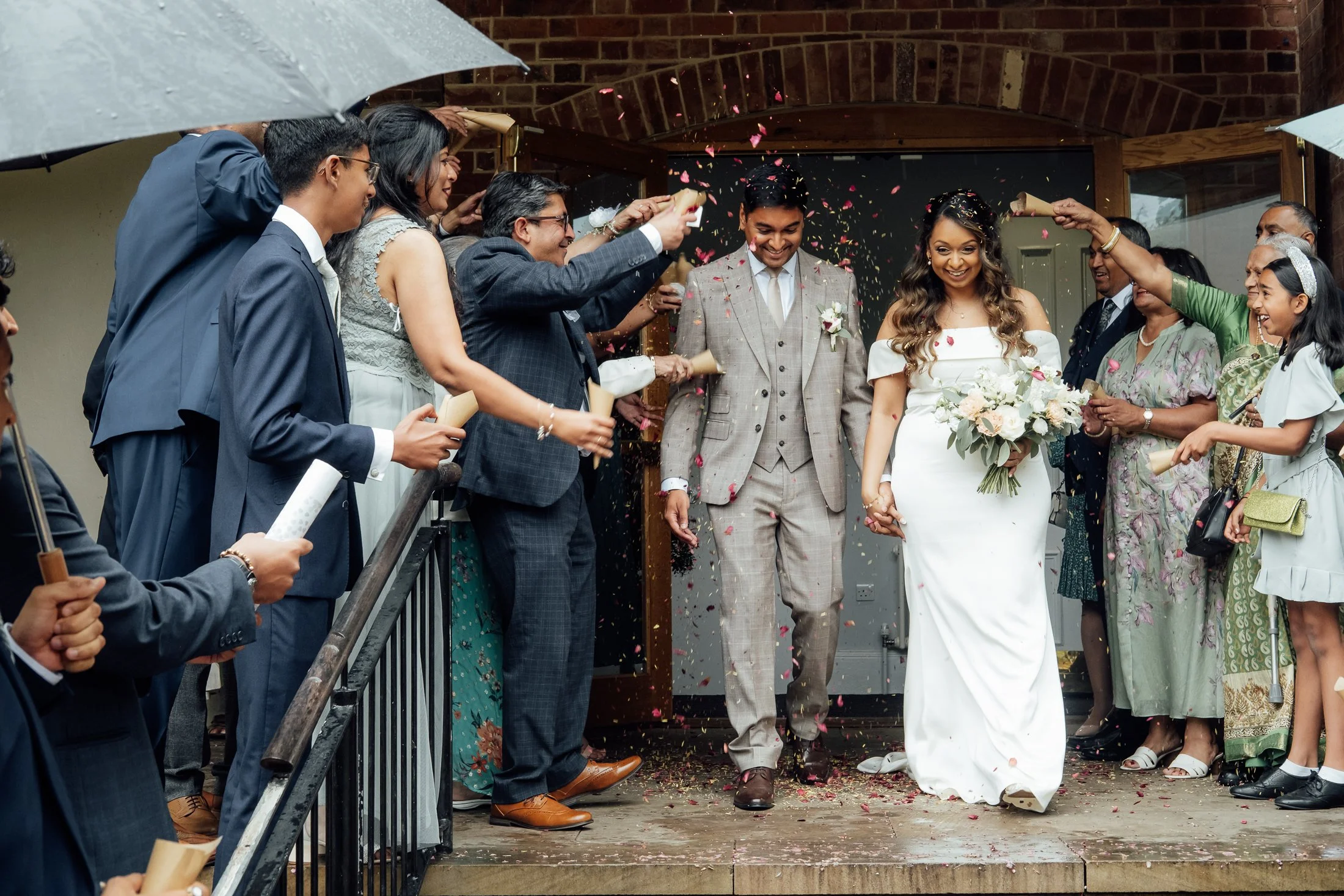 Guests celebrating with confetti cannons at Bridgford Hall