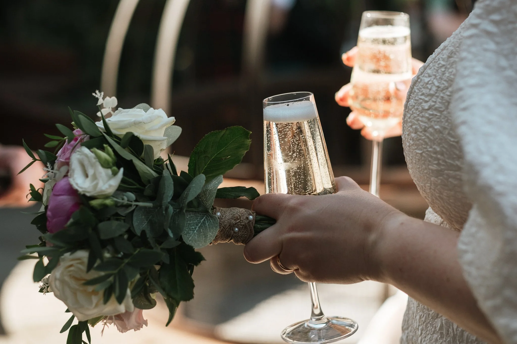 bride holding a glass of champagne