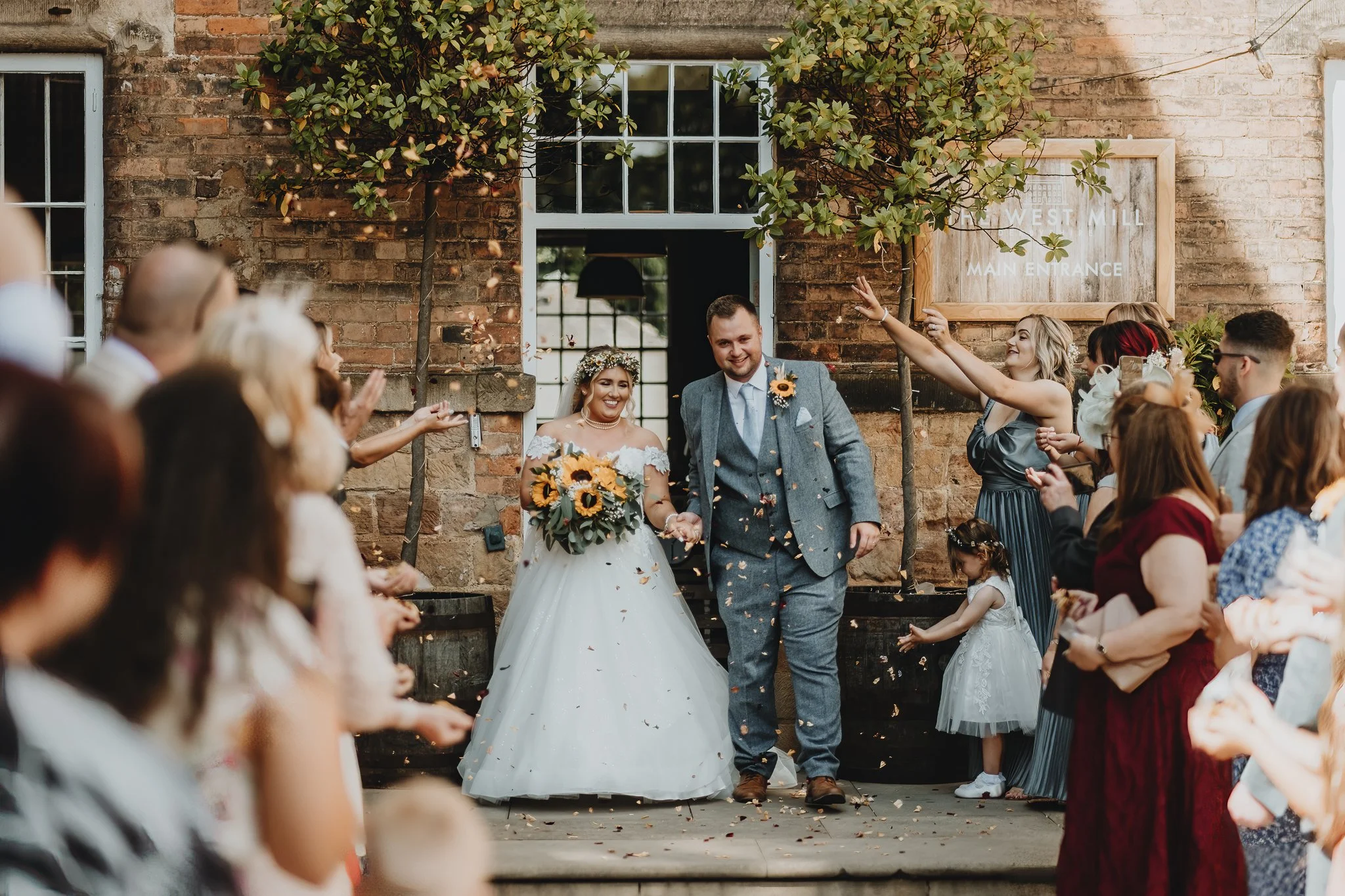 Bride and groom enjoying their wedding day at The West Mill