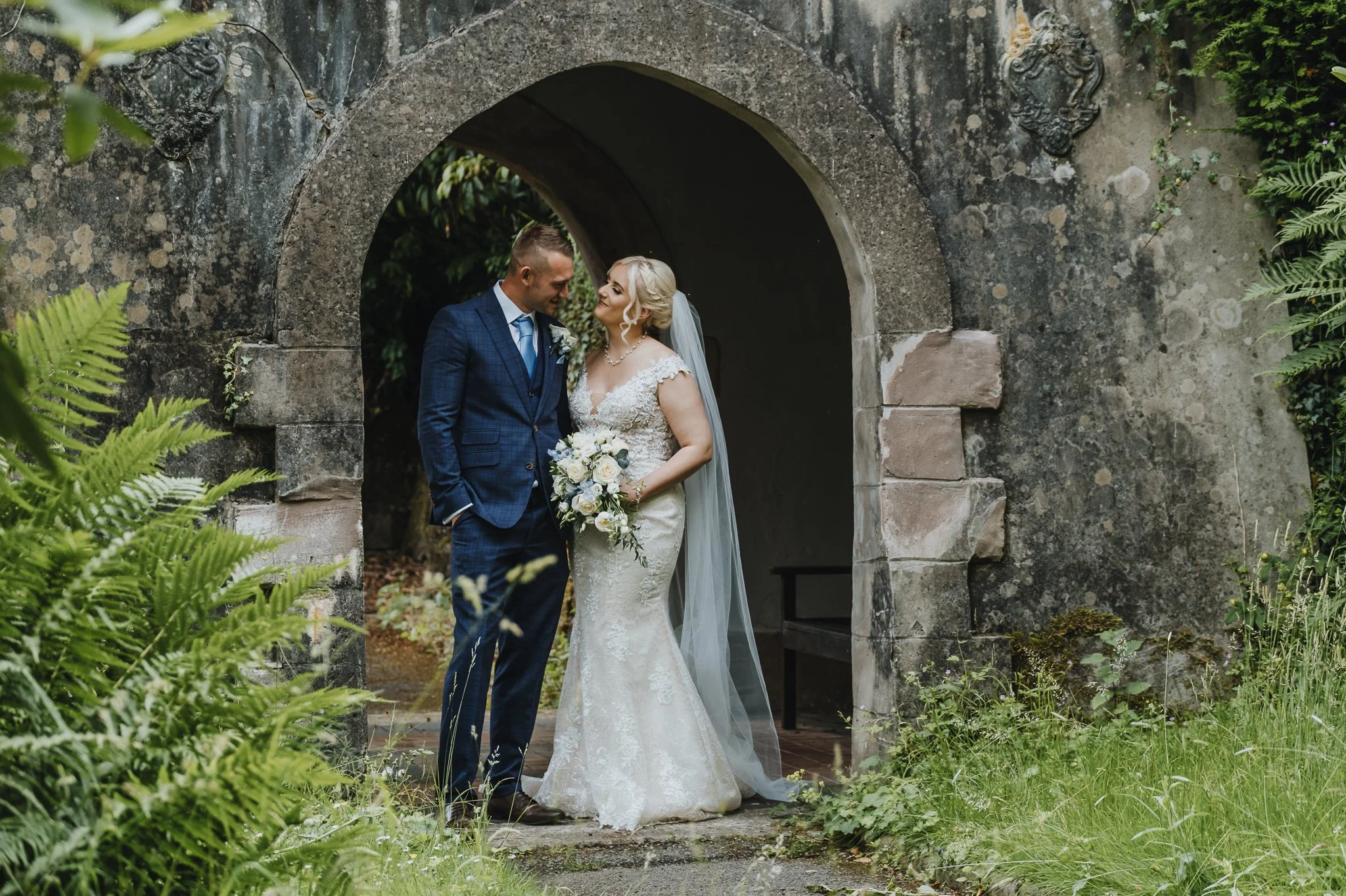 Bride and Groom under the bridge at Foxtail Barns