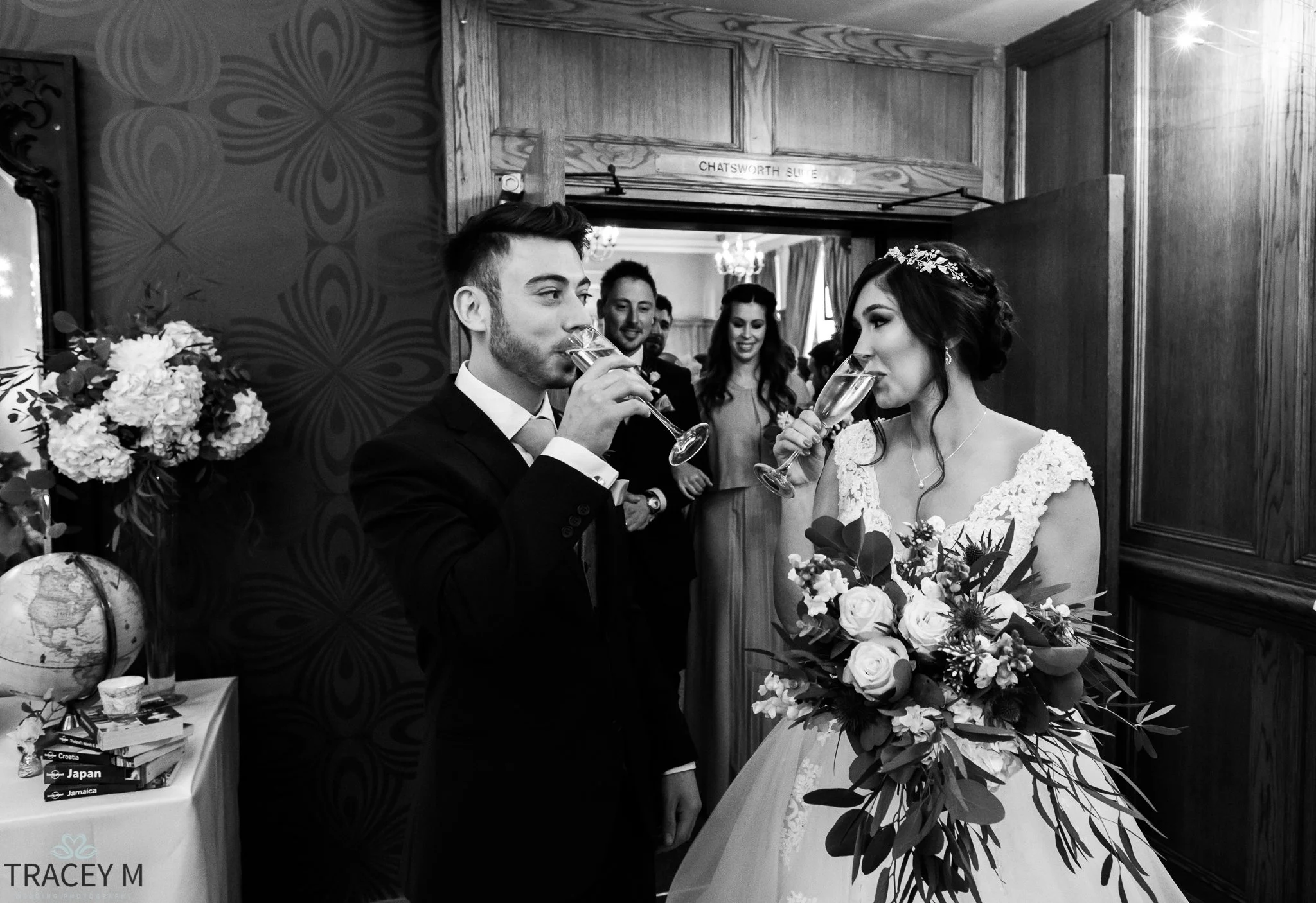 bride and groom with celebratory drinks at The Maynard in the Peak District