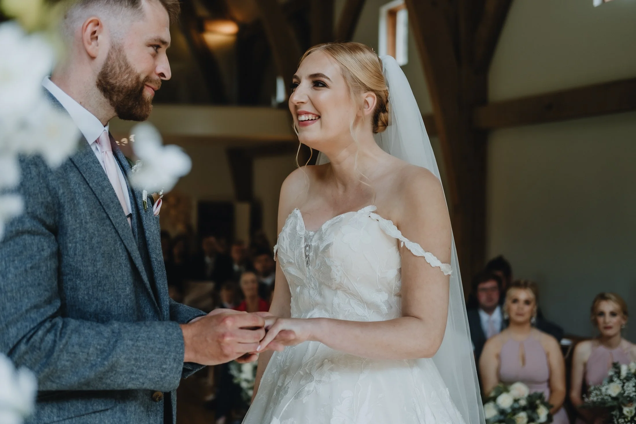 Bride and groom exchange wedding vows at the Mill Barns in Shropshire