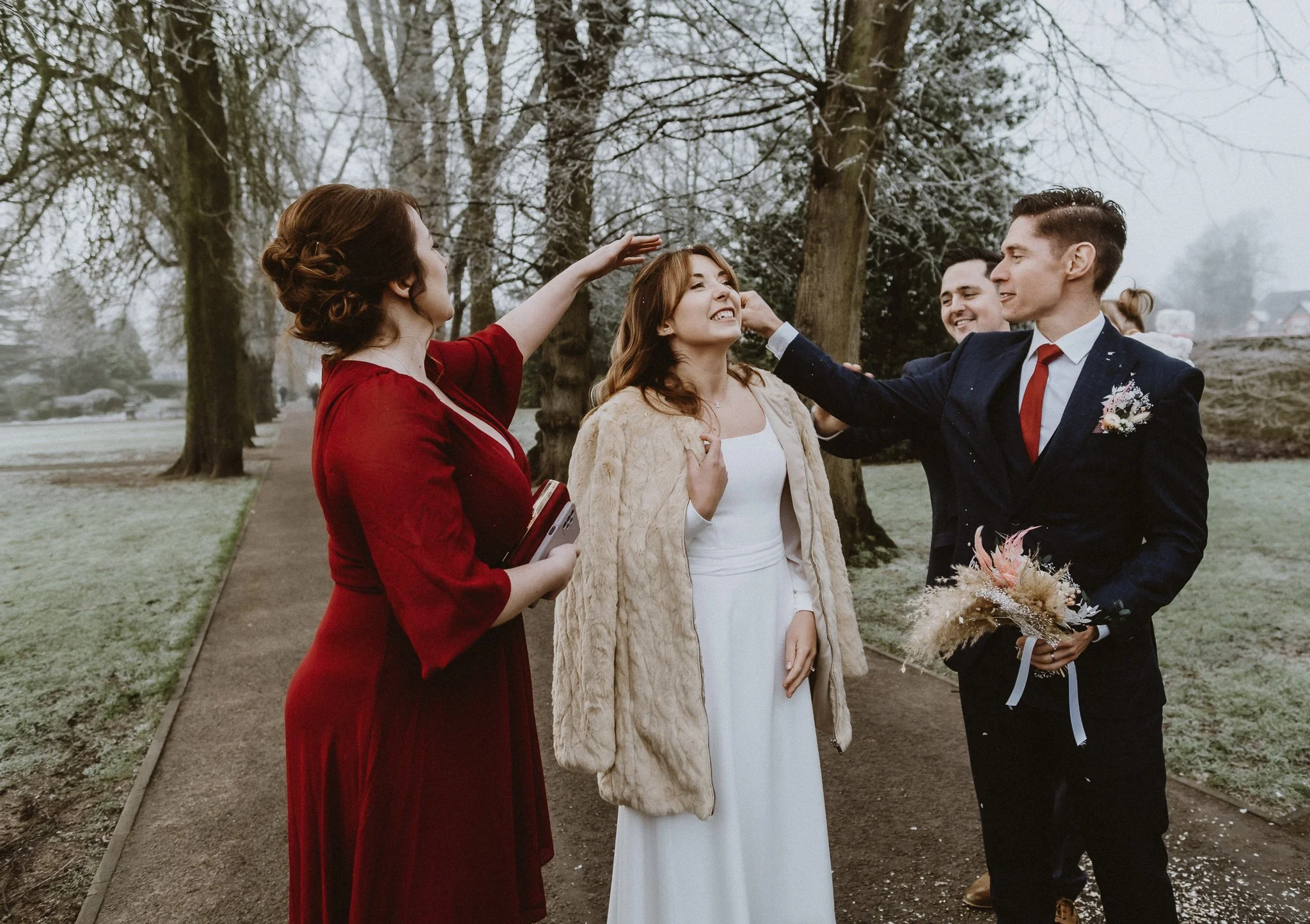 guests removing confetti from brides hair documentary wedding photography Lichfield