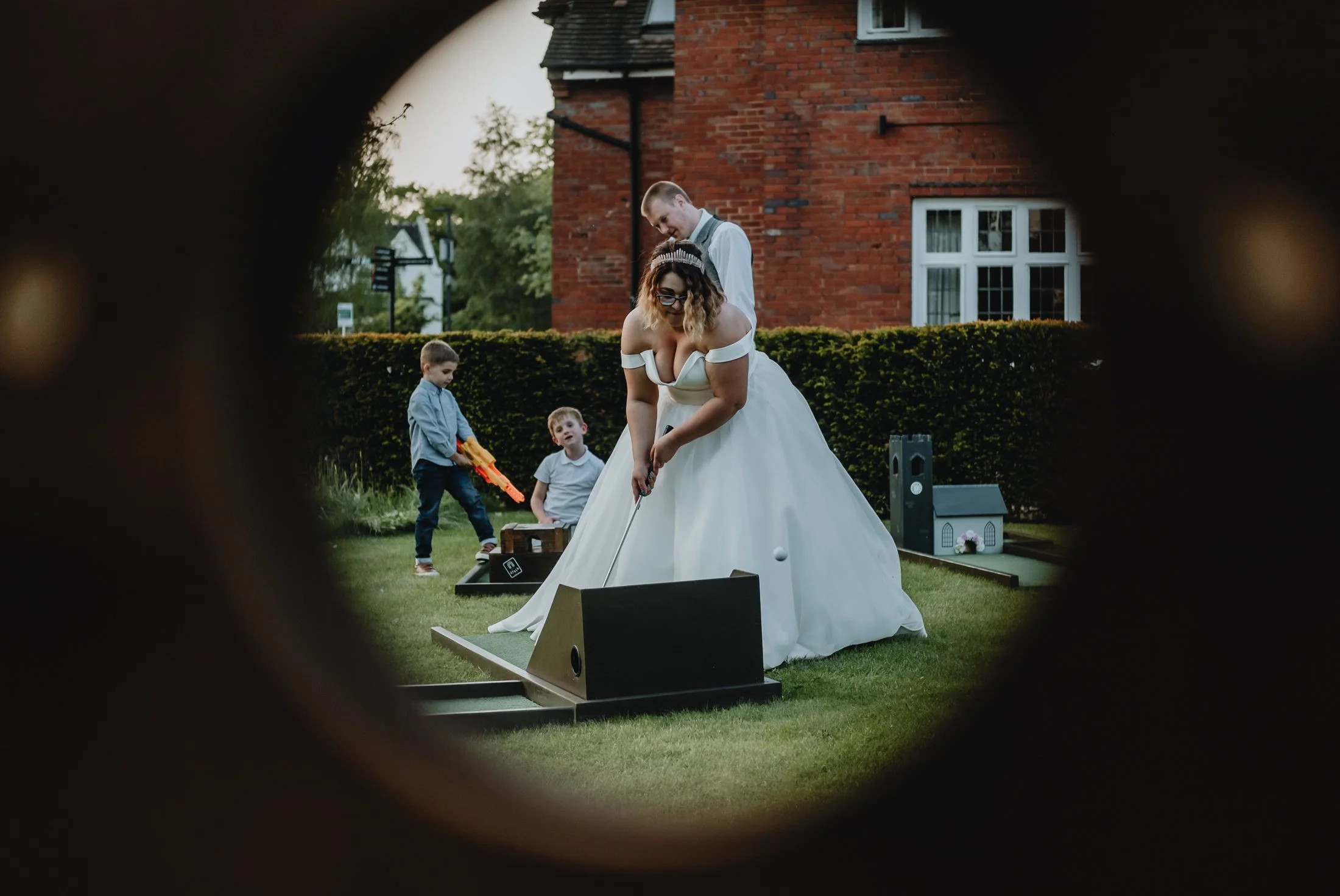 Bride playing crazy golf at her wedding