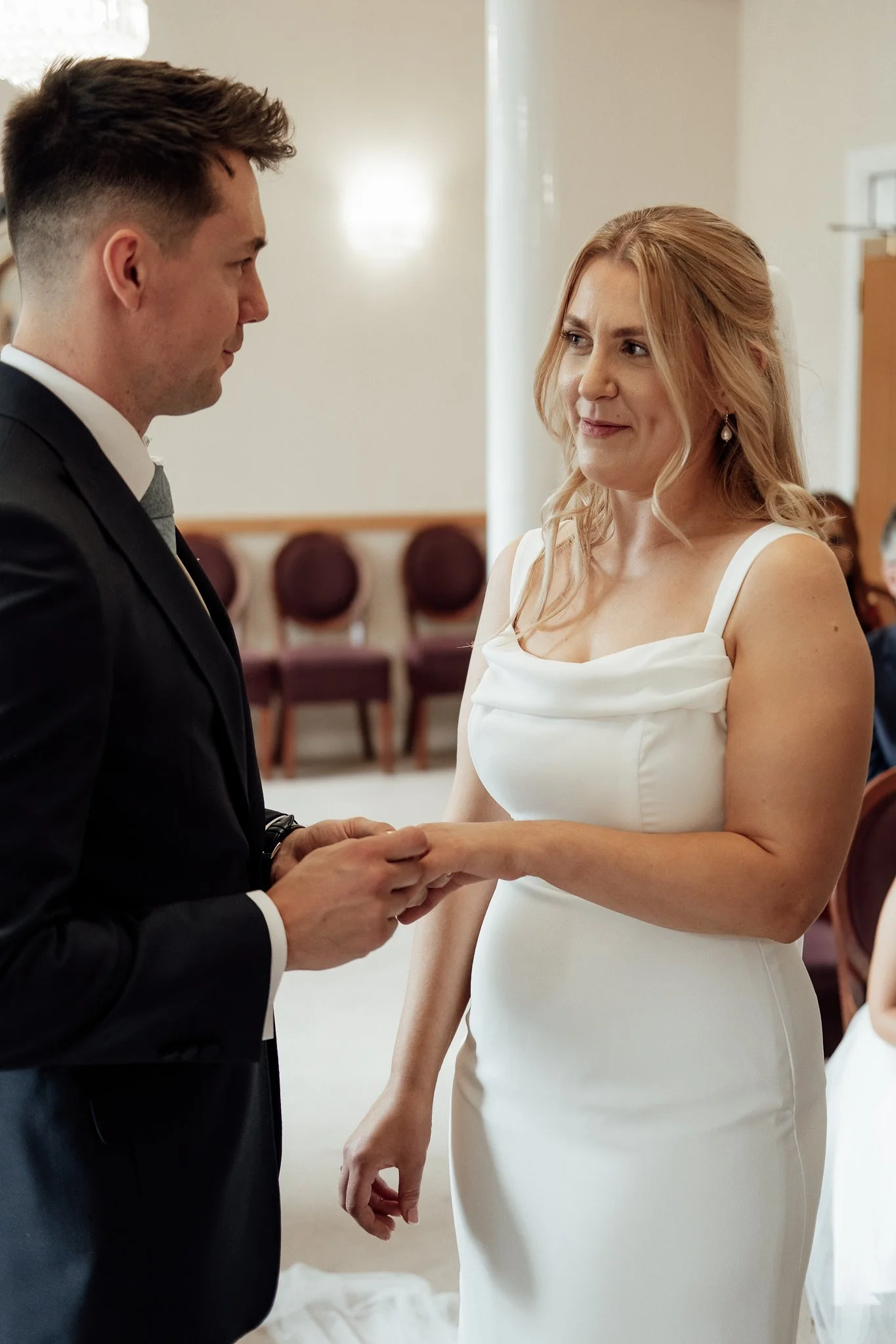 Bride and groom exchanging wedding vows at Lichfield Registry Office