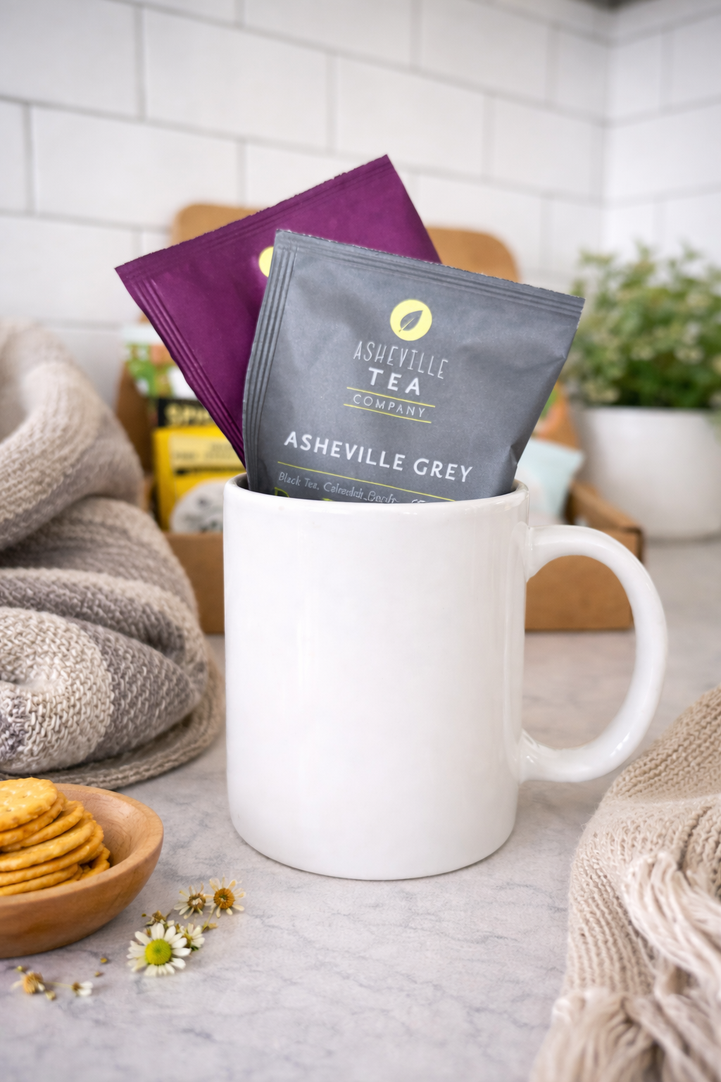 Cozy tea moment with crackers and chamomile.png