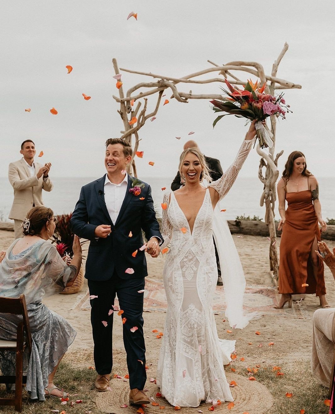 In love with #MoondanceBride Miranda's beautiful beach celebration! Glowing in Lyria by @ruedeseinebridal paired with the Lennox sleeves. ⁠
⁠
Congratulations babe!⁠
⁠
#bridalshop #californiabride #centralcoastbride #santabarbarawedding #beachwedding 