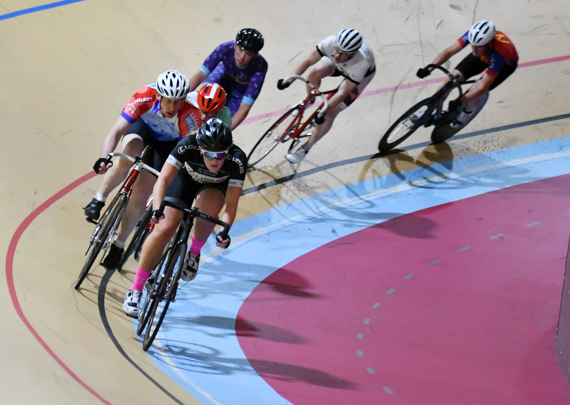 From front, Autumn Caya, 15, of Shelby Township, Kurt Westphal, 56, of Northville, Rebecca Hartrick, 16, of Auburn Hills, Jackson Robar, 27, of Detroit, Charles Moore, 45, of Plymouth and Mark Atkinson, 51, of Northville ride warm up laps. Robin Buckson, The Detroit News