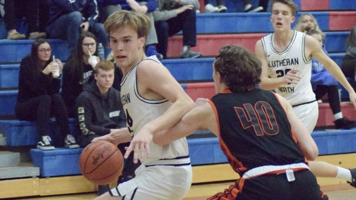 Lutheran North holds off Marine City in district basketball semifinal game