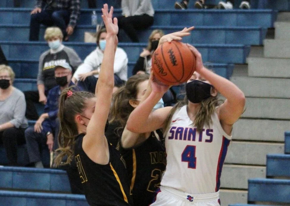 Lutheran North holds off St. Clair to win district basketball championship