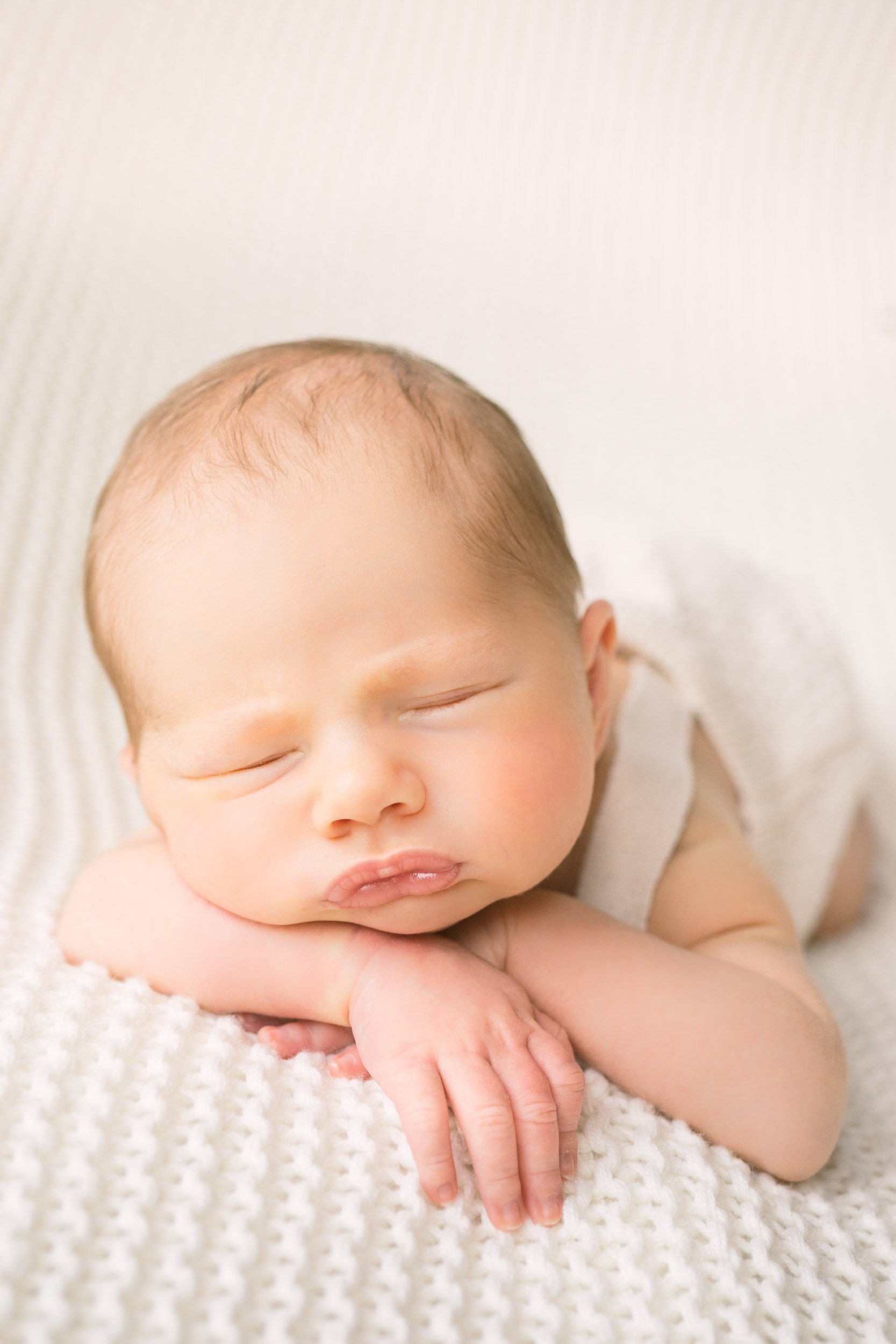 Babyfotografie Neugeborenenfoto Baby auf Decke