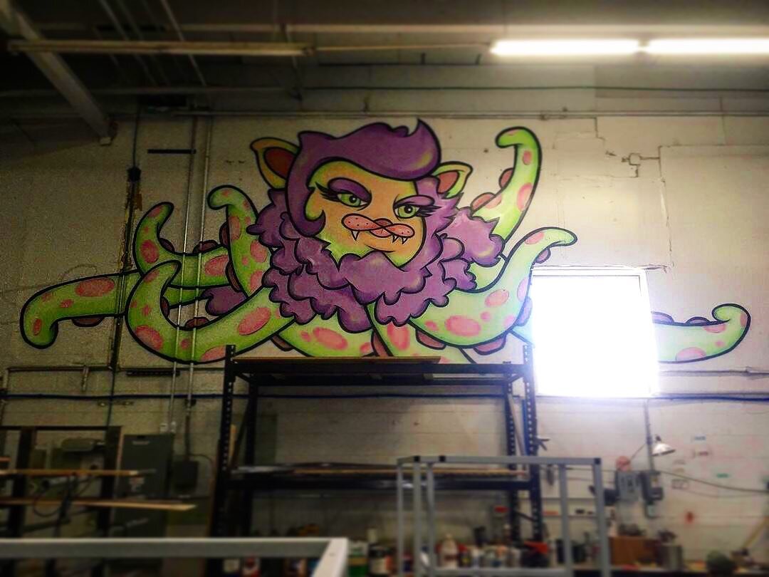 Our good buddy @mikeroane is almost wrapped up with our #Octopussy on the shop wall. She first graced our alley wall out our first shop on Broadway 7 years ago. Anyone have a good name for her? #badkitty #streetart #artistsoninstagram #artislife

.
.