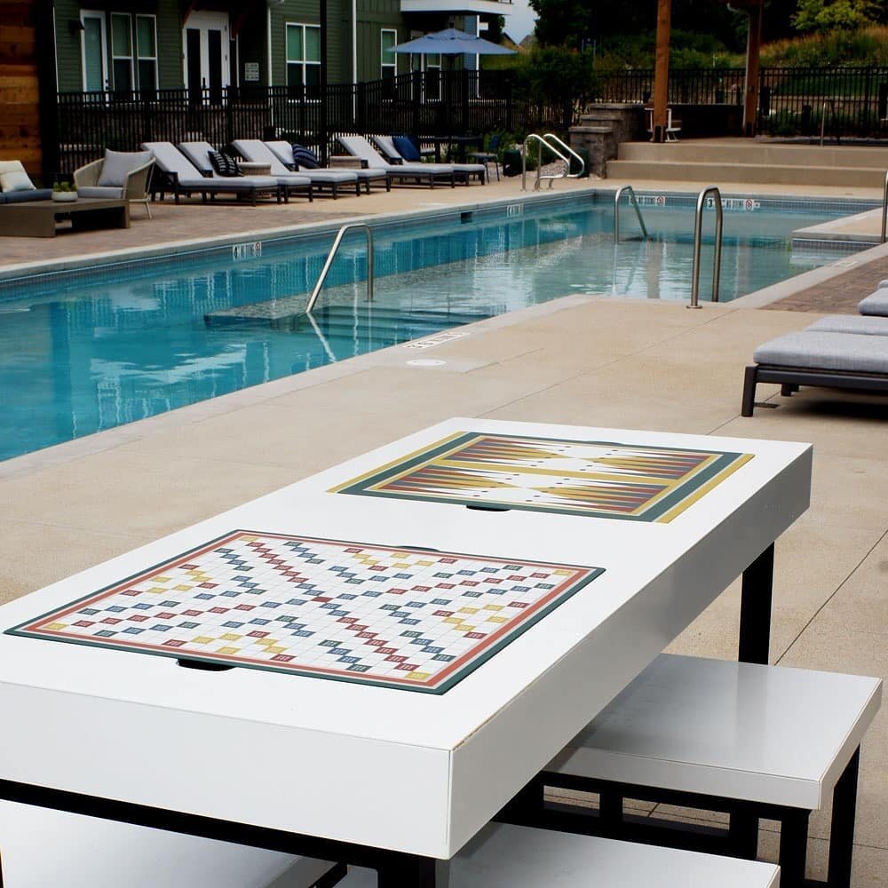 This set of poolside game tables comes with 4 unique weather proof vinyl wrap game boards, and inset storage compartments under each board. Made out of powder coated steel, they stay looking clean and cut in any weather or location. 

Hope everyone h
