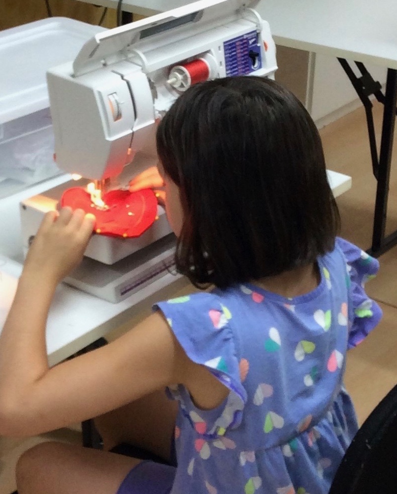 Learning to sew at Fun Camp