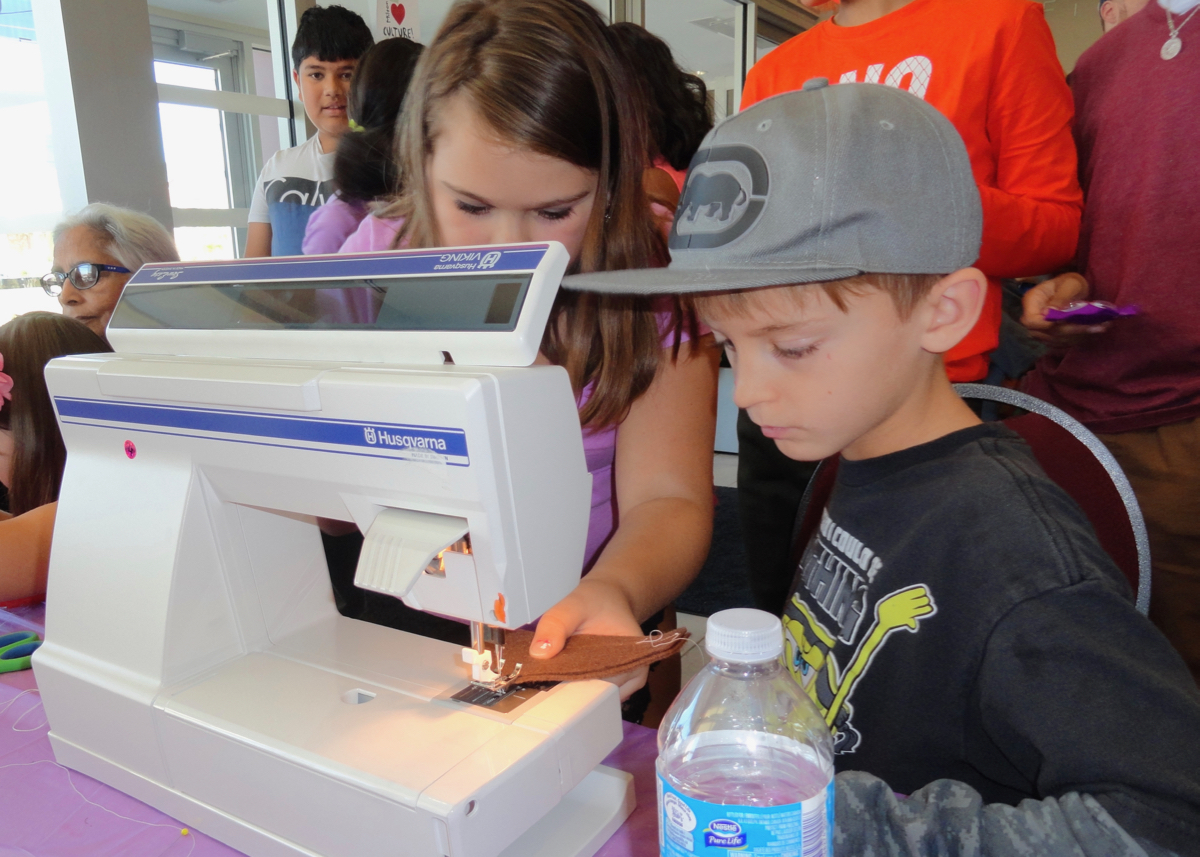 Kids learn to sew at Althea's