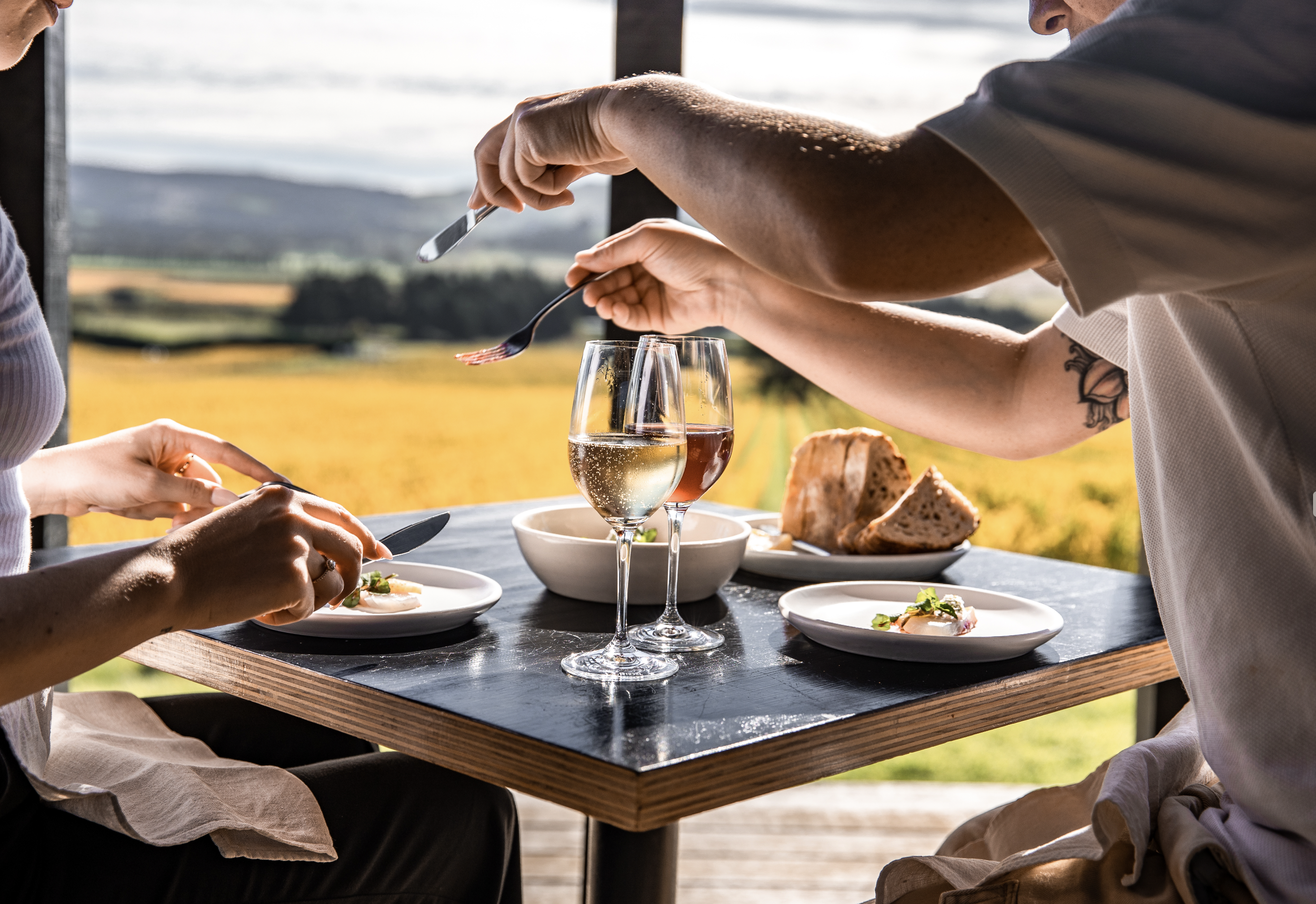People enjoying a long lunch at Black Estate Wines. Dine in. Award-Winnning.